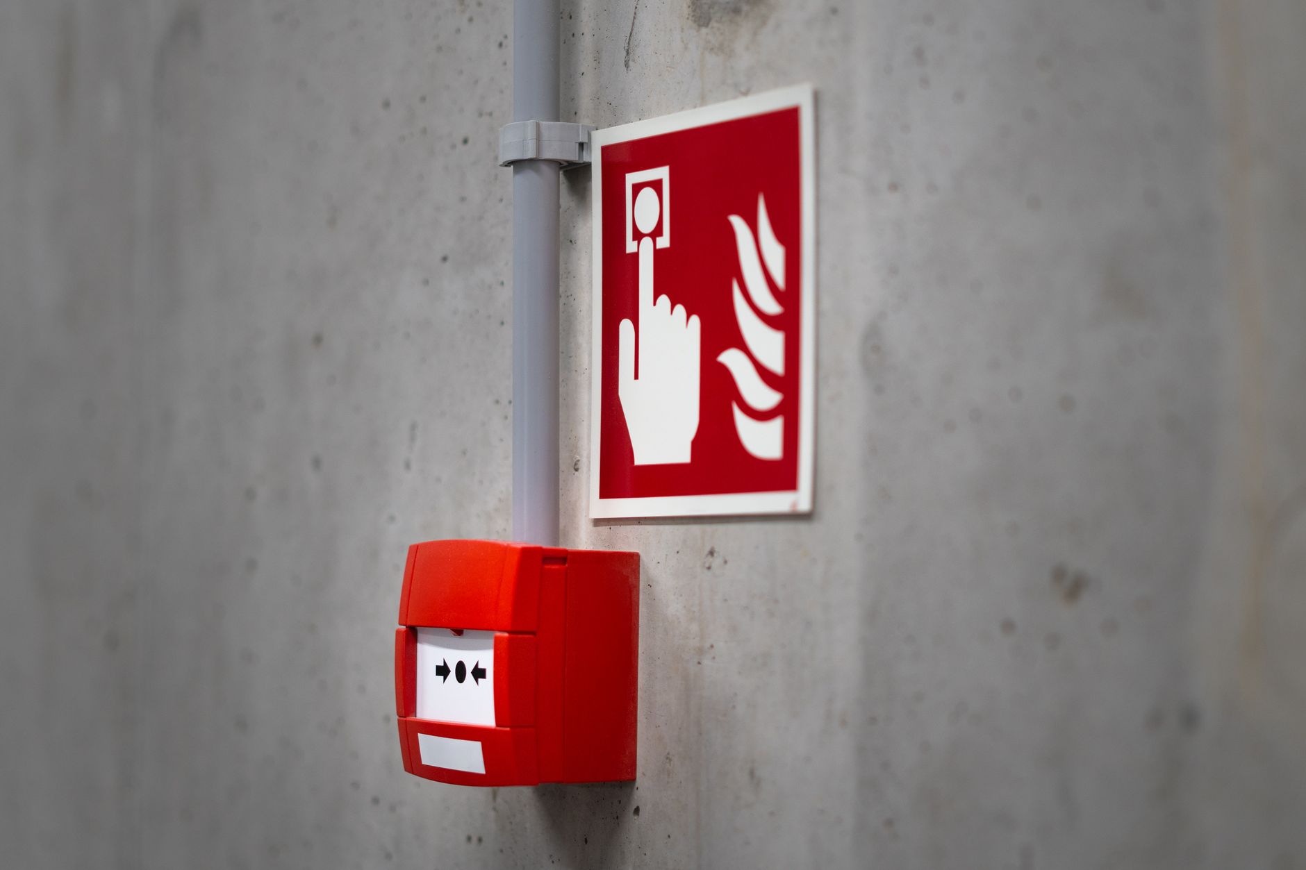 A fire alarm pull station on a wall