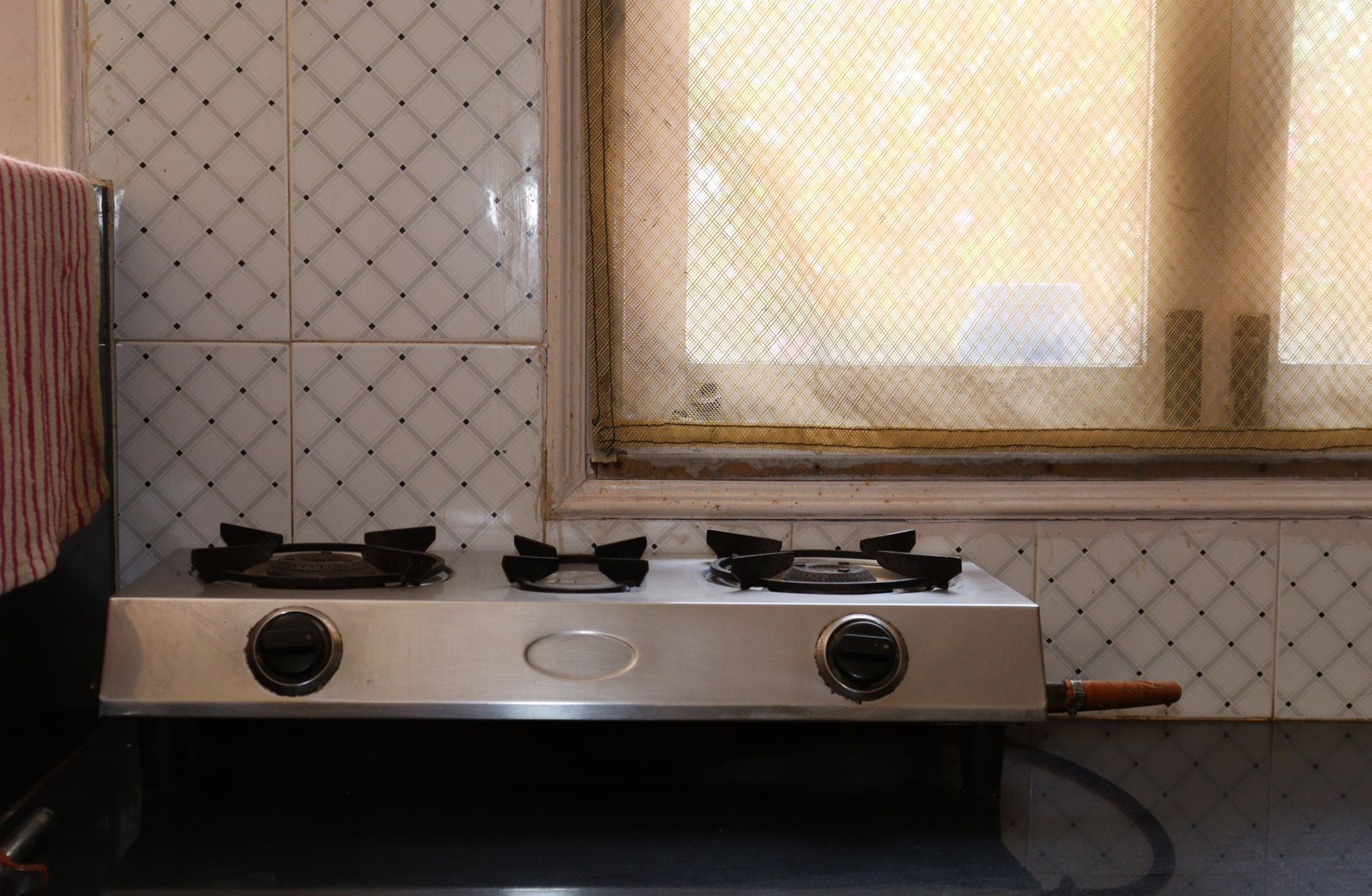 A two-burner stove under a window