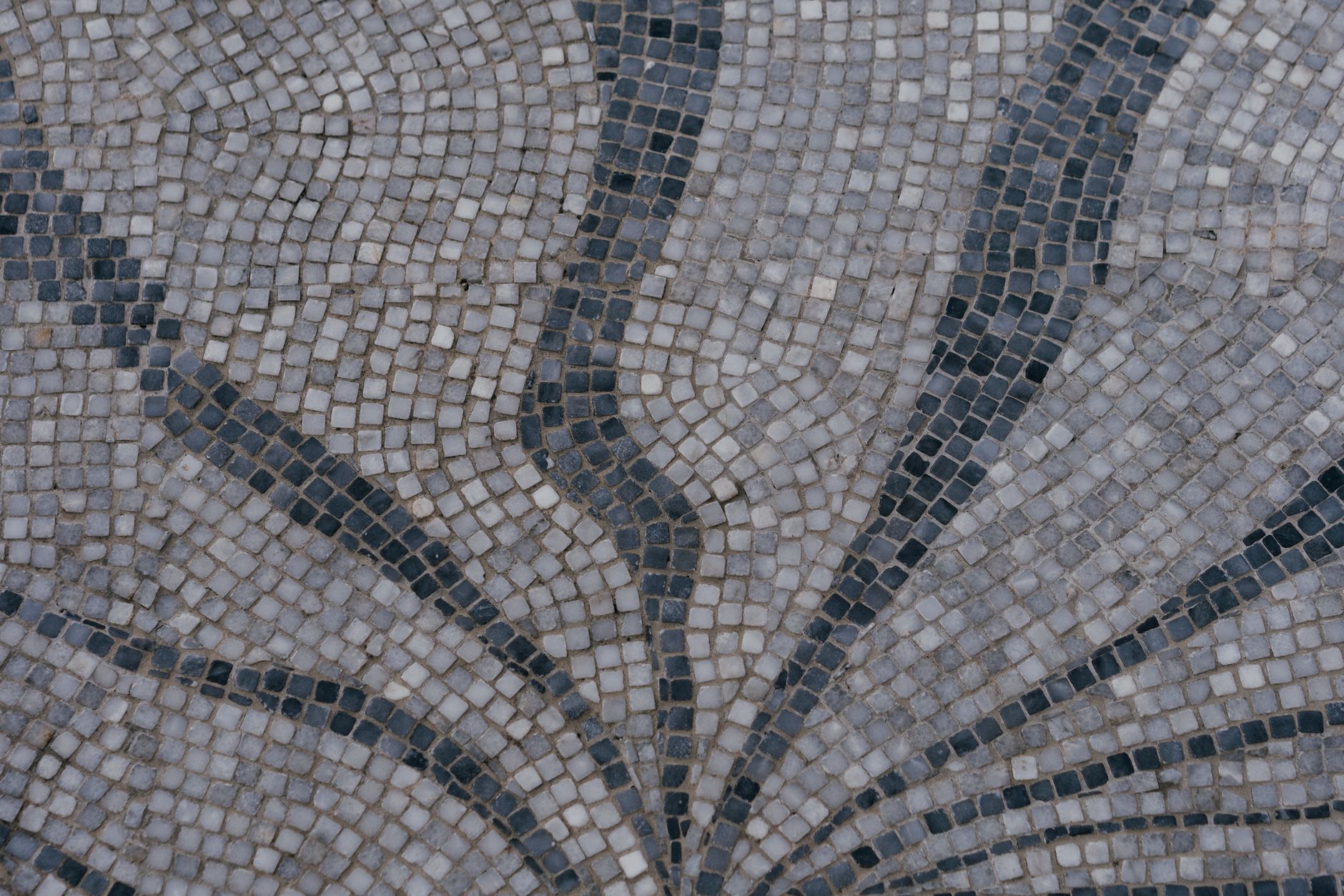 A gray and white mosaic tile pattern
