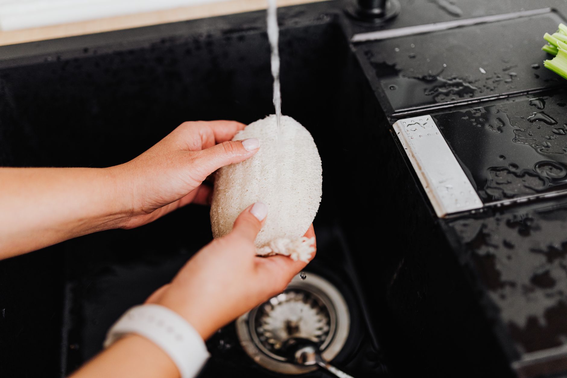 Best sponge holder: a kitchen sink with a sponge and dish soap nearby