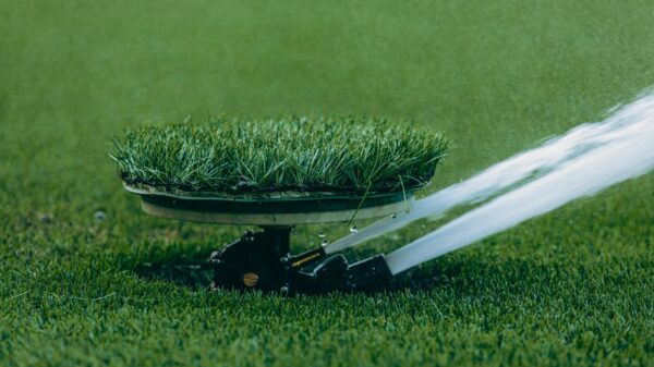 Best sprinkler: a sprinkler spraying water across a lawn