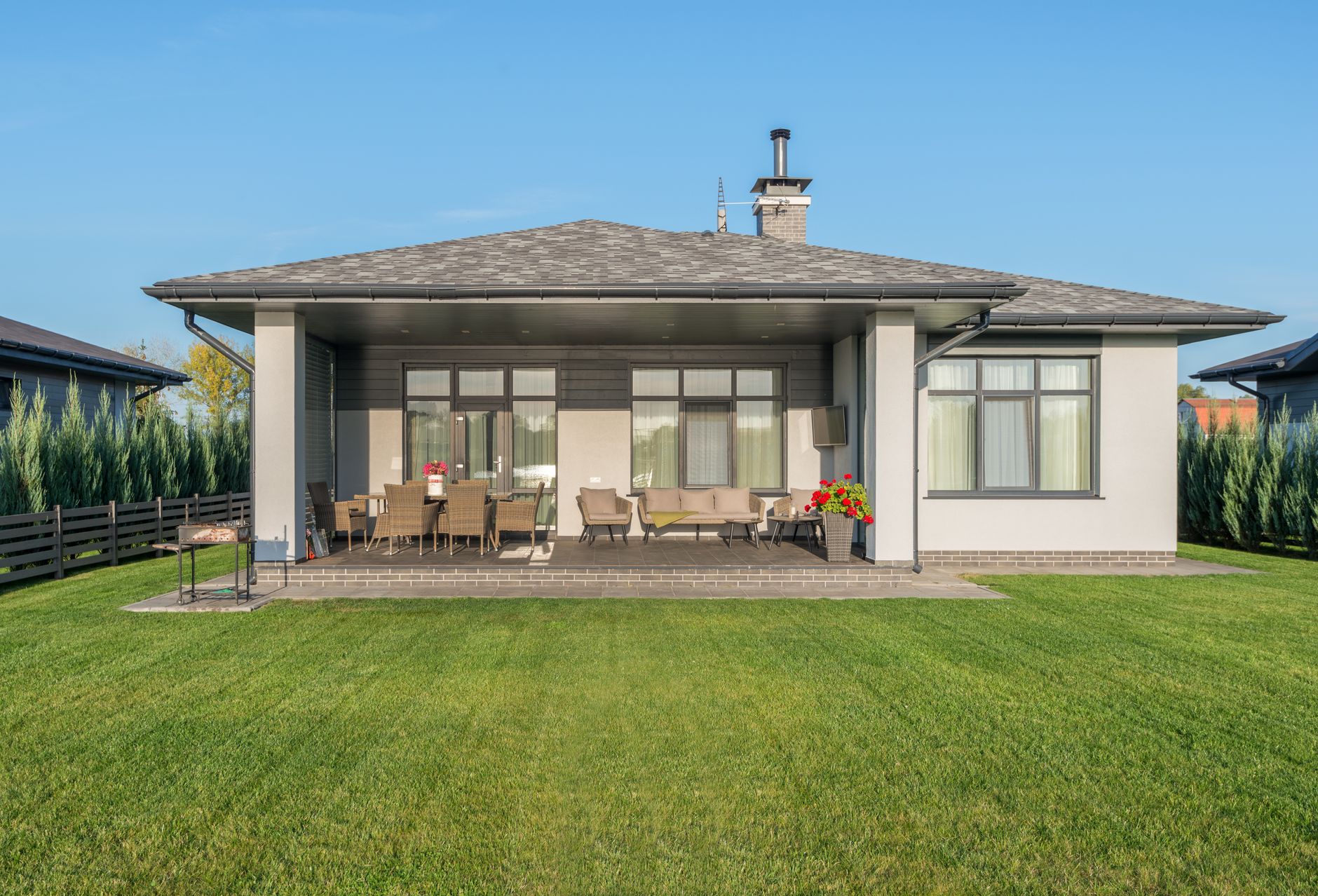 A green lawn behind a modern house
