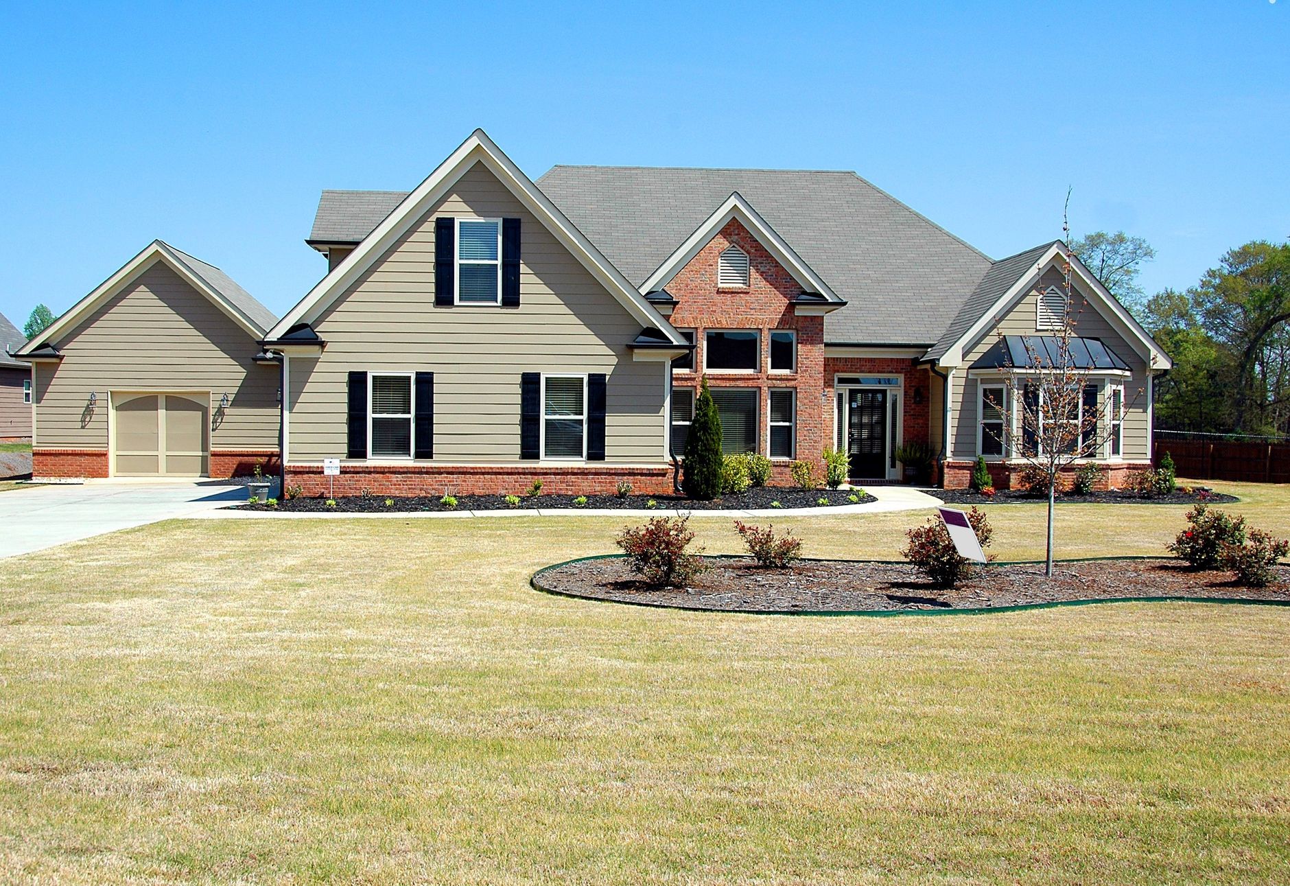 A suburban house with a front lawn