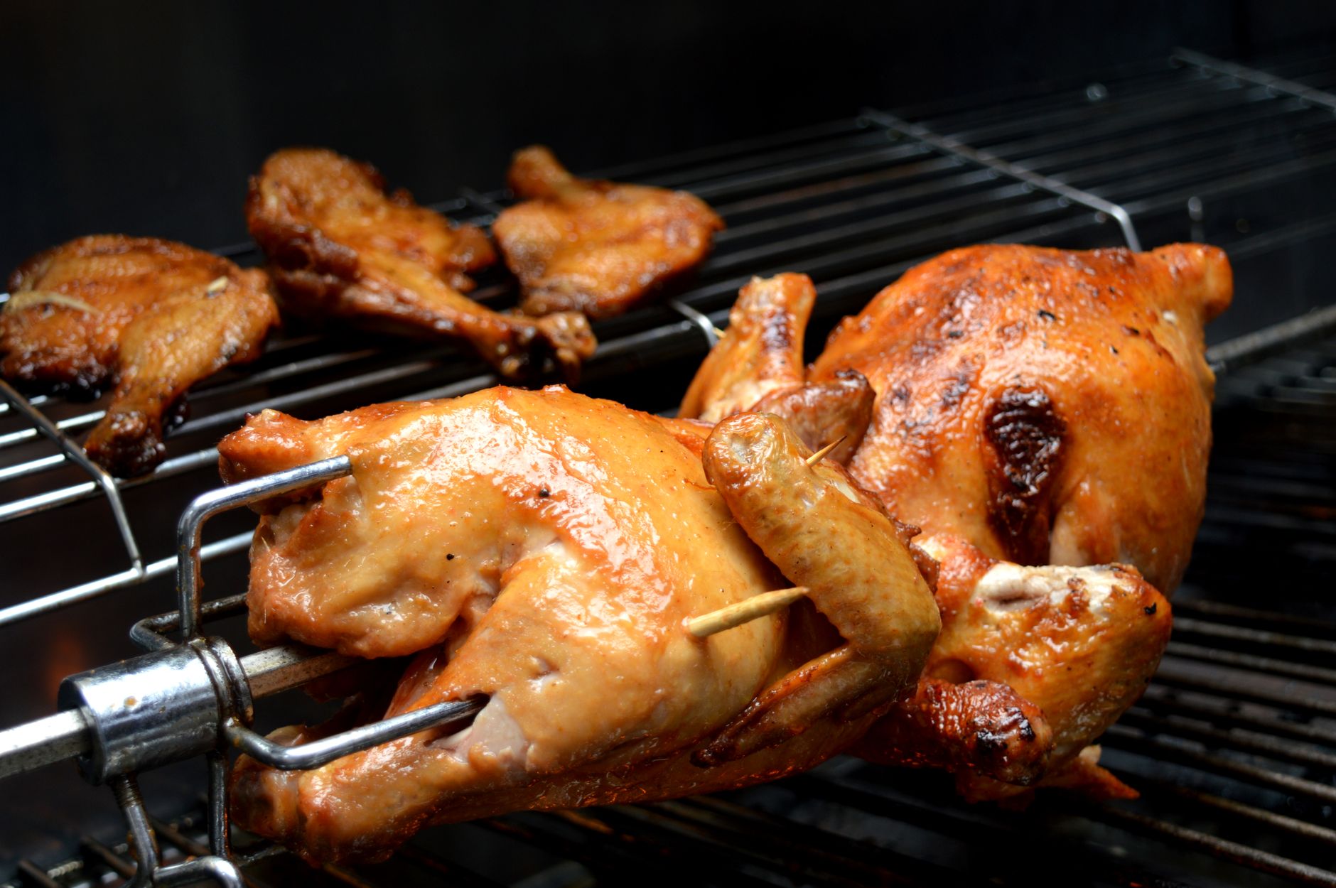 Chickens on a rotisserie spit