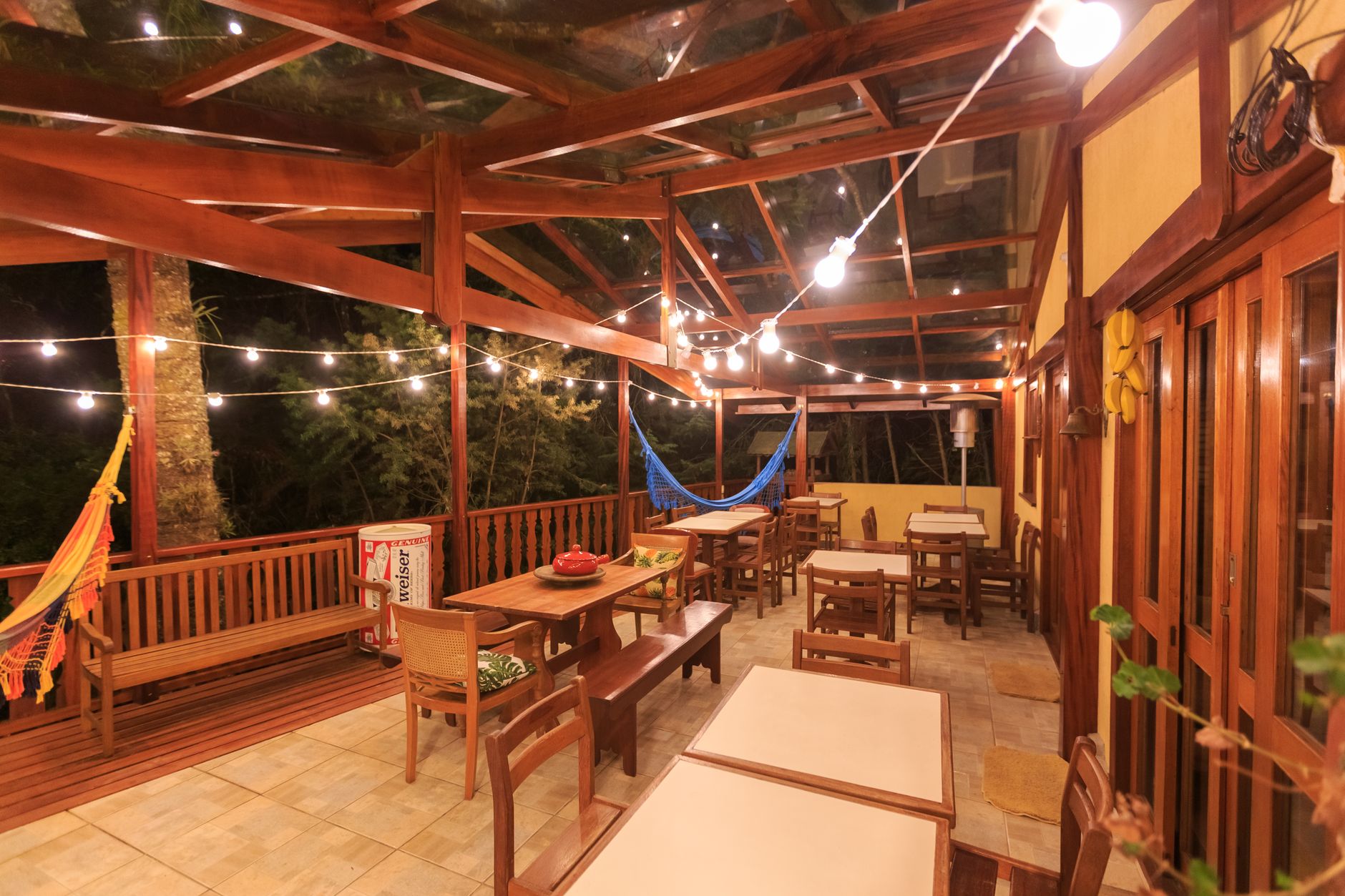 A covered patio with string lights