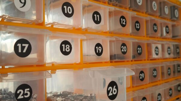 Numbered clear bins on an orange rack