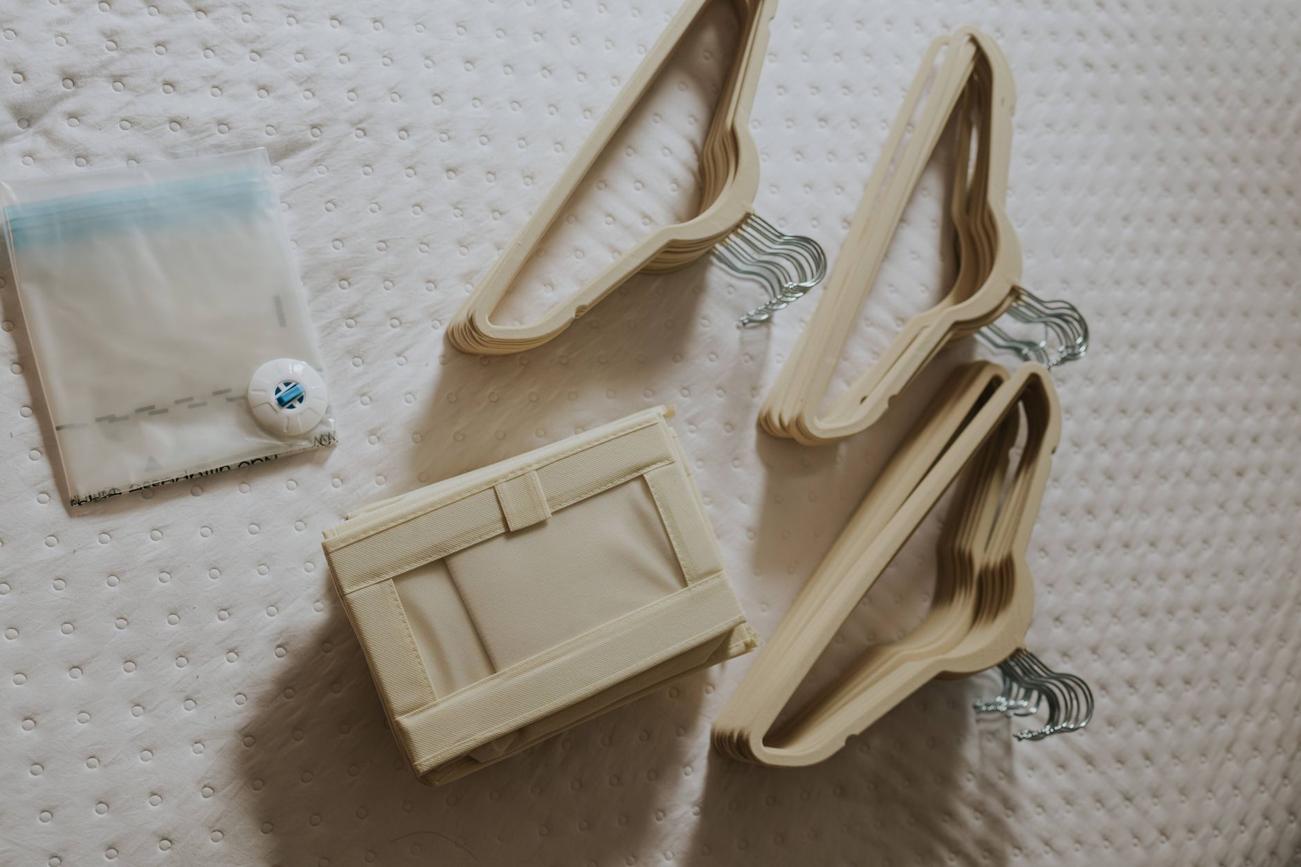 Folded hangers and a small fabric bin