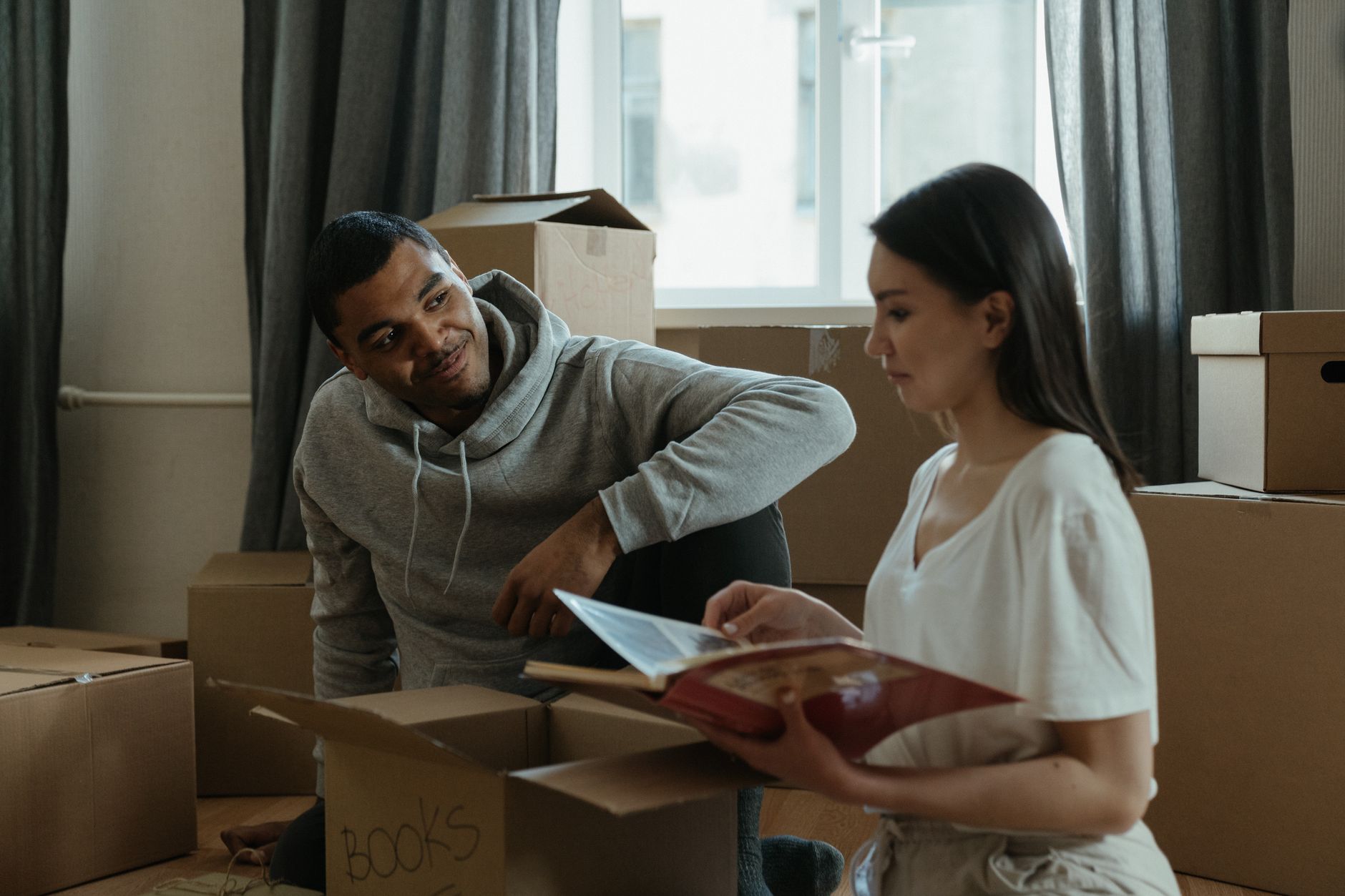 A couple unpacking boxes in a new home