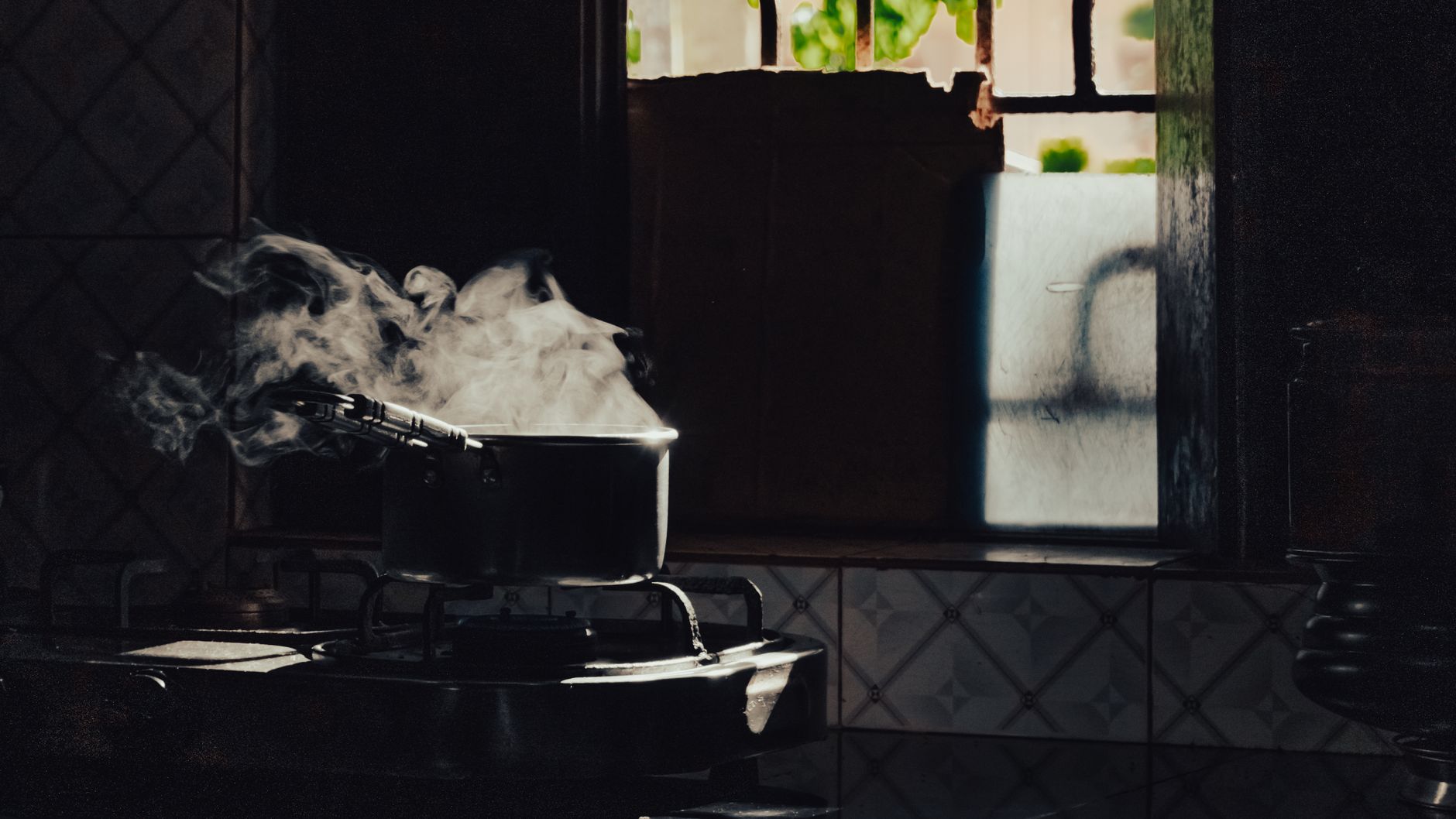 A steaming pot on a stovetop