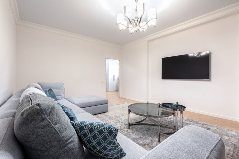 A living room with a wall-mounted TV