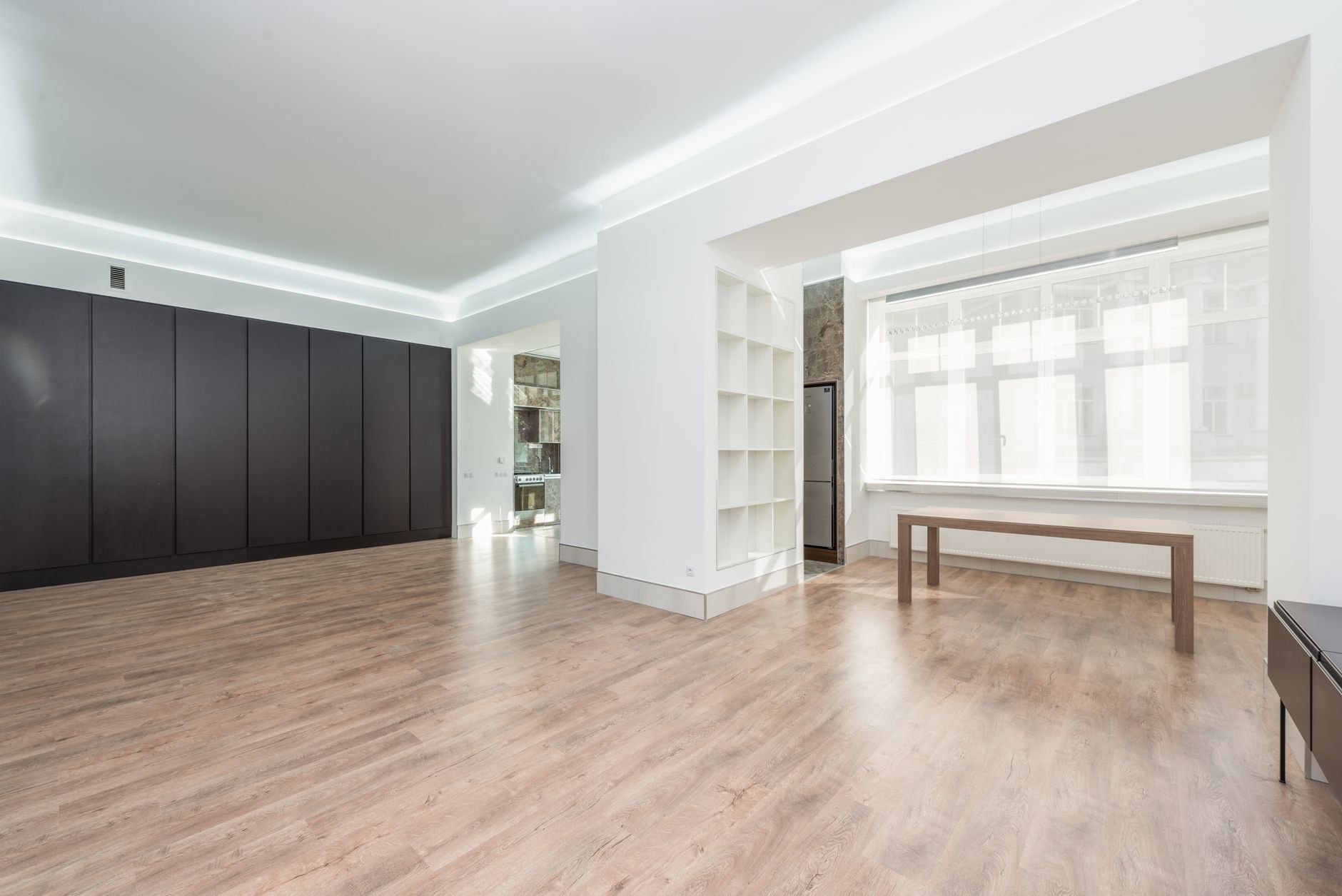 An empty room with a long wall