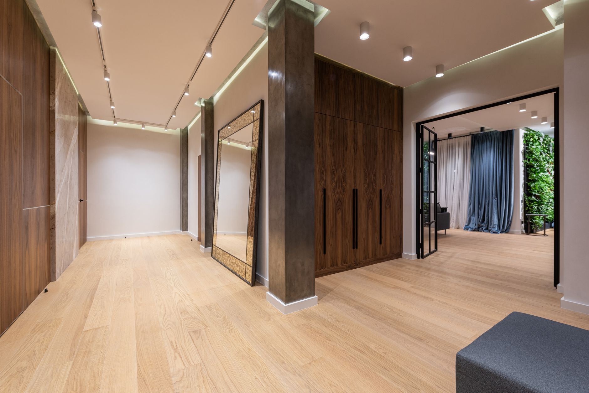 A hallway with tall wood panels