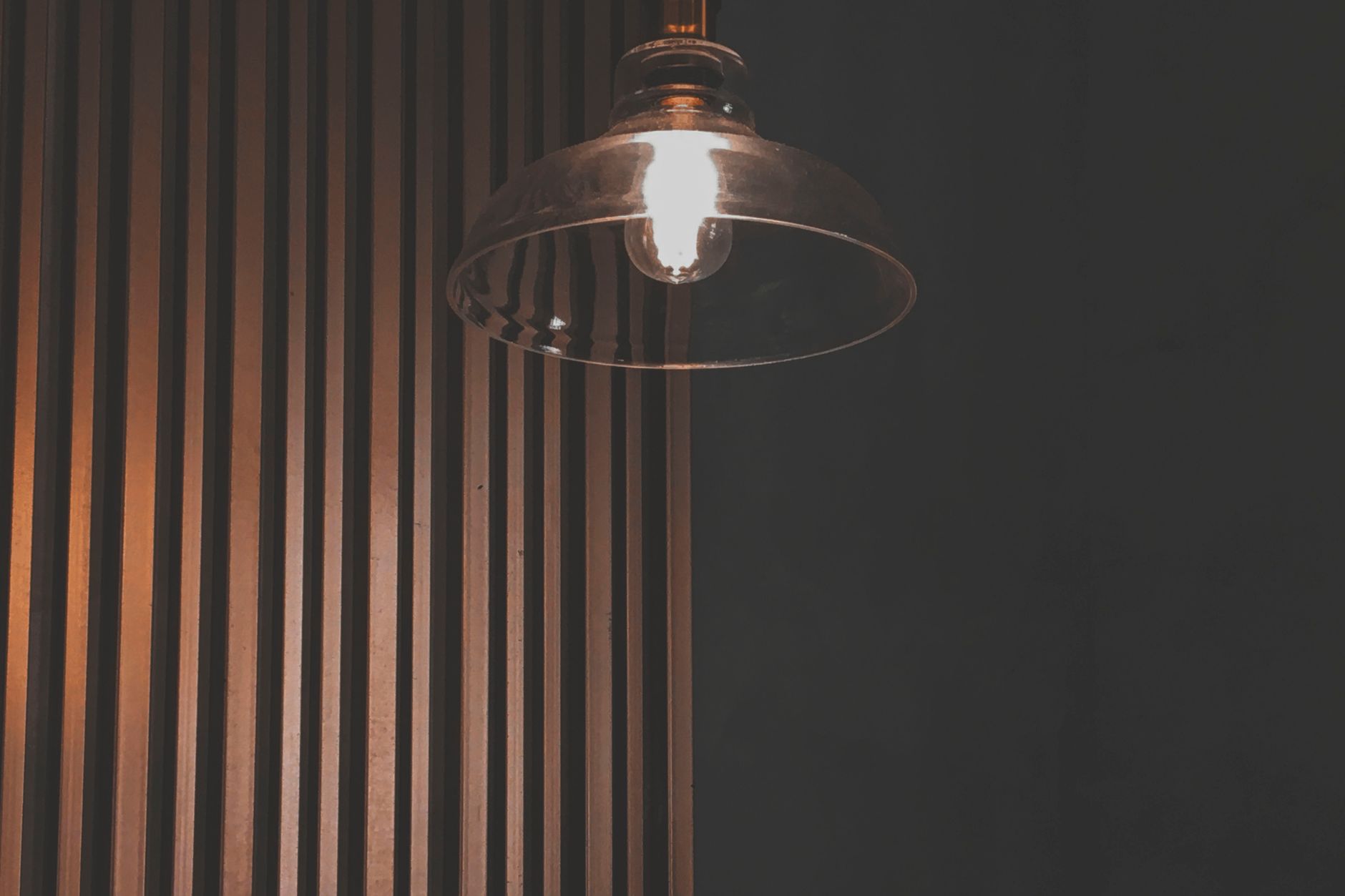 A fabric lamp shade softening warm light