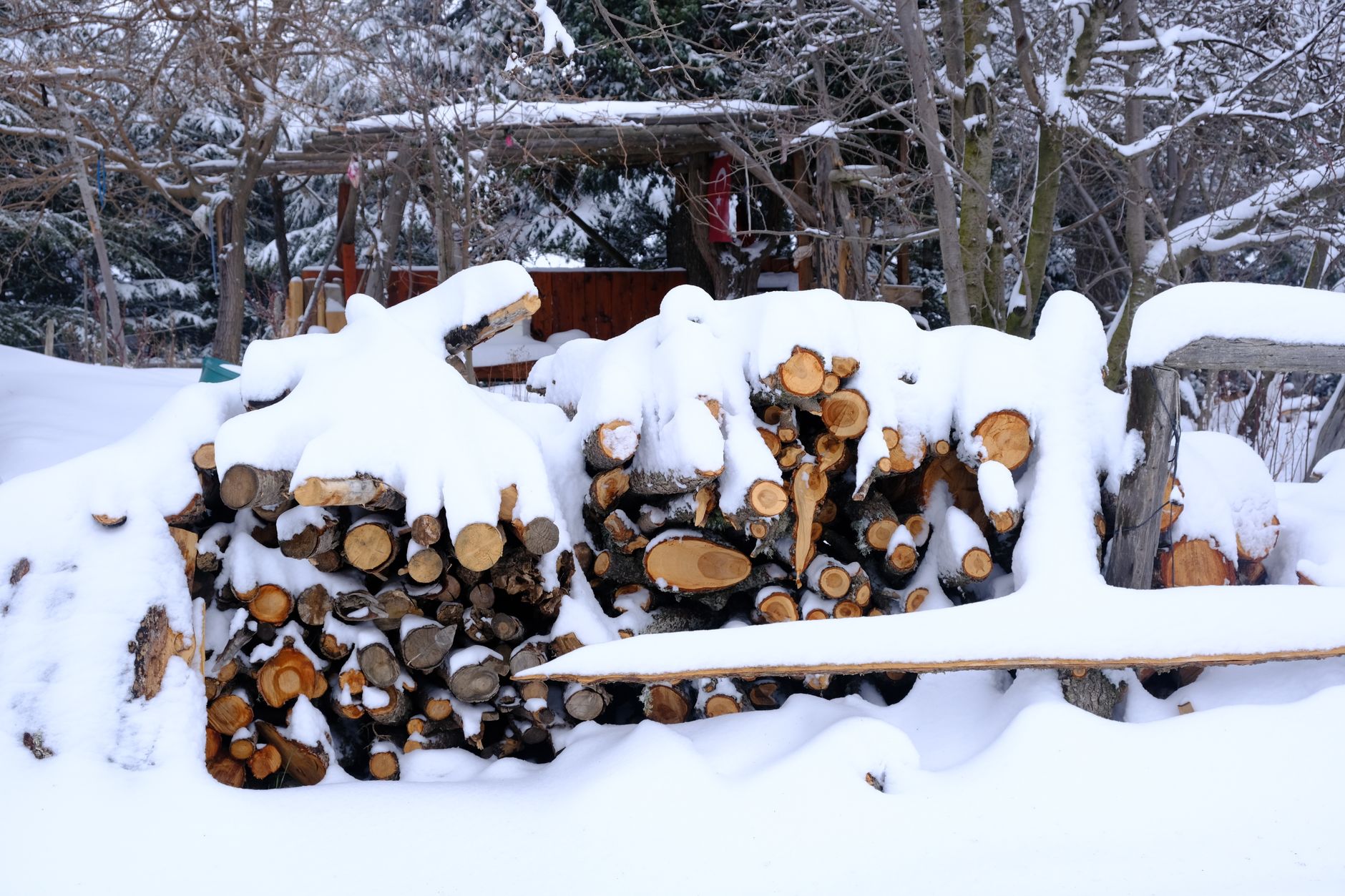 A woodpile outdoors in winter