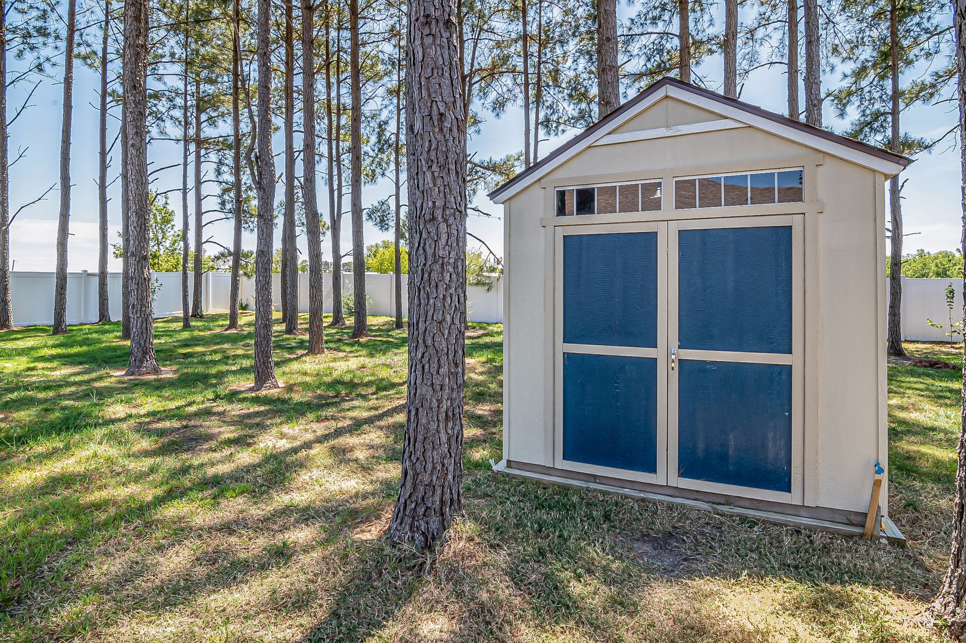 A garden shed in a backyard