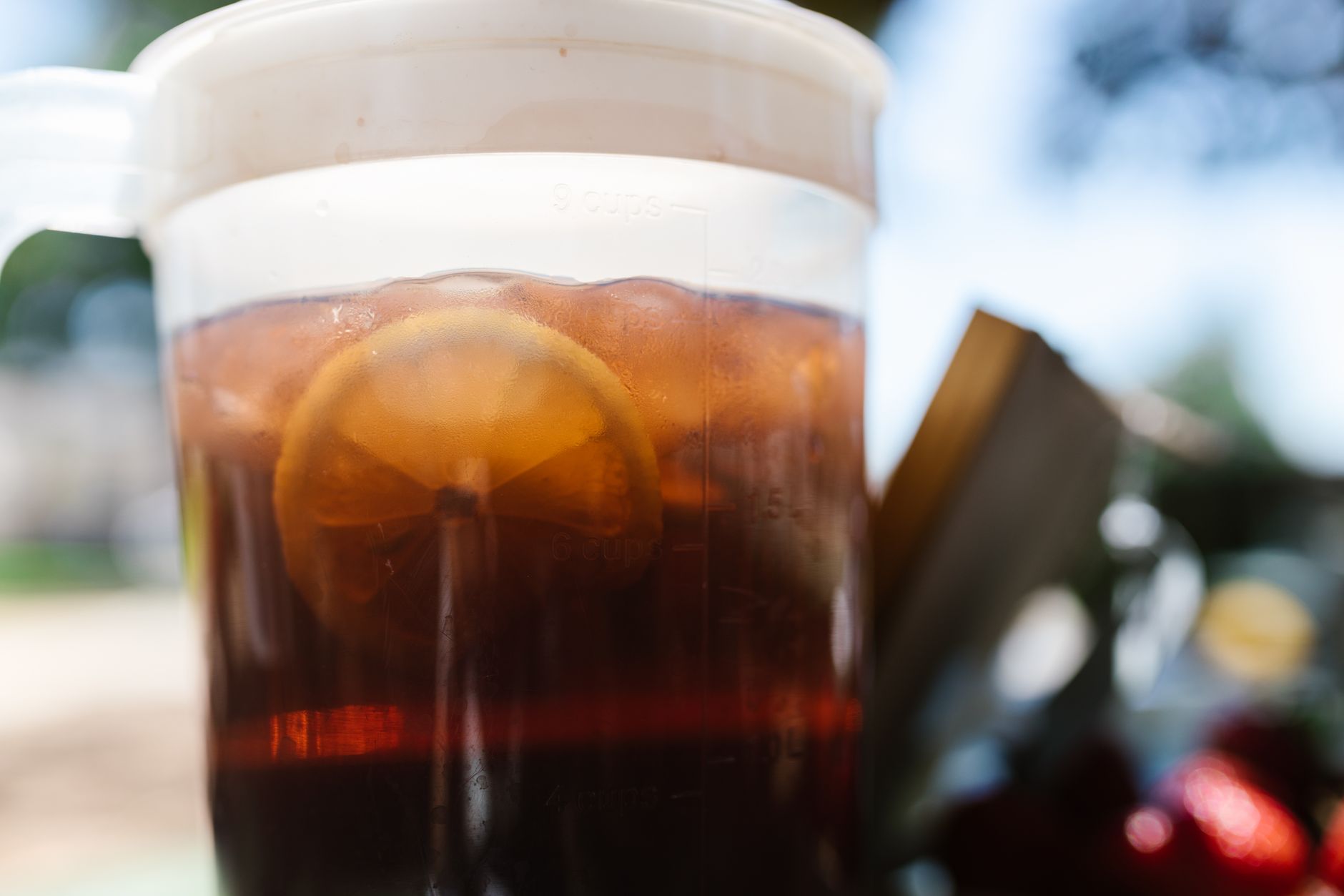 A pitcher of iced tea with glasses