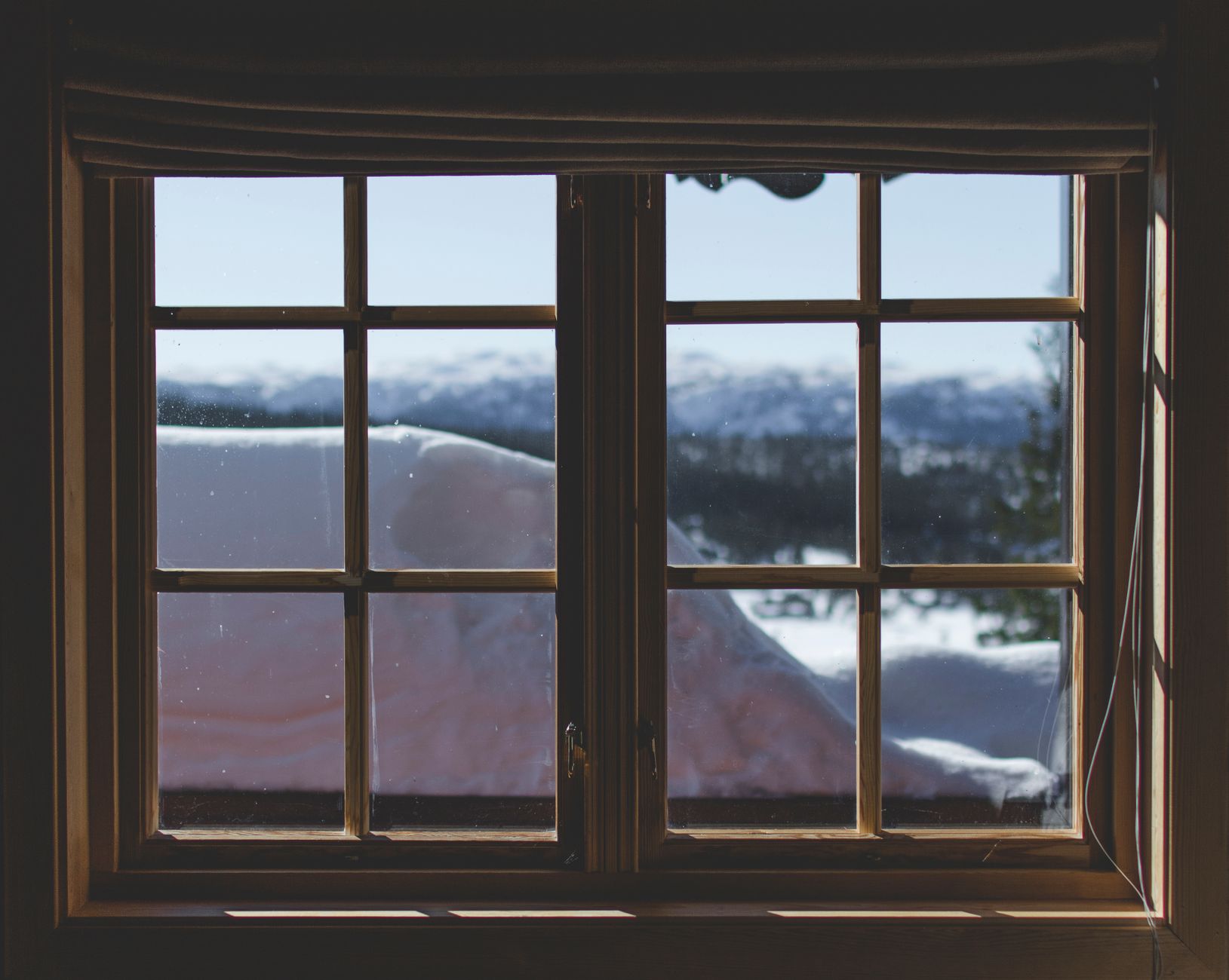 Snow seen through a window from indoors