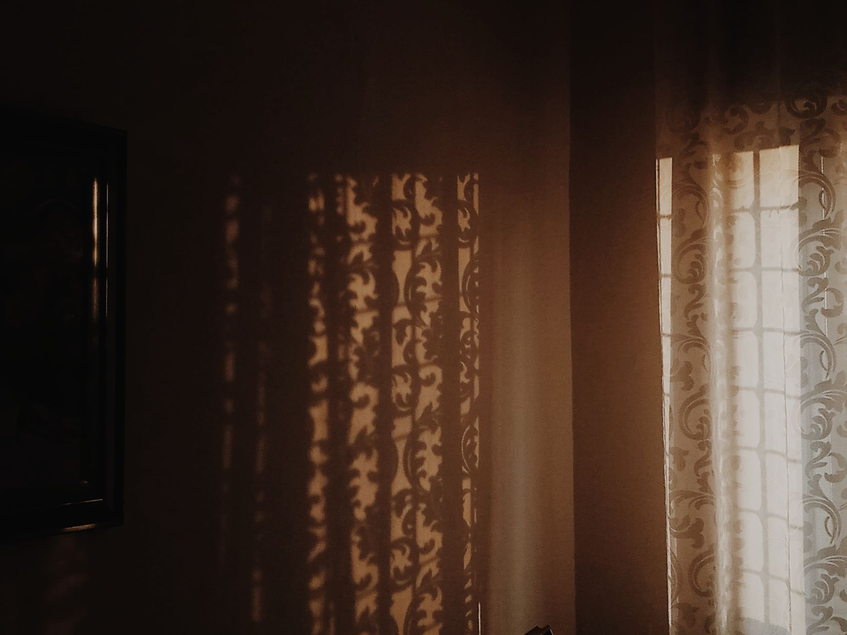 Sunlight coming through partly open curtains