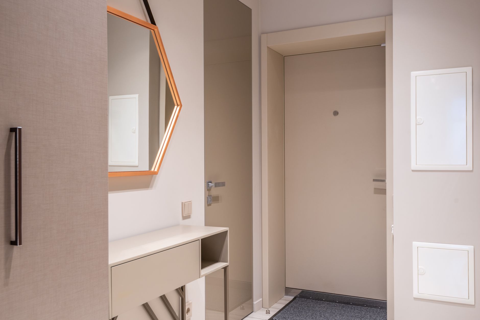 An apartment entryway with an interior door