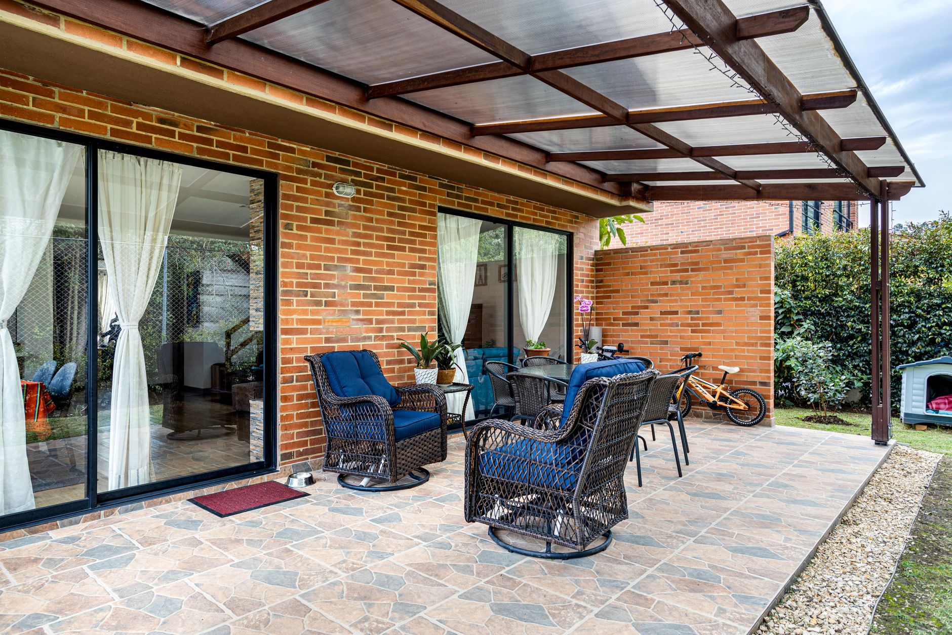 Sliding glass doors opening onto a covered patio