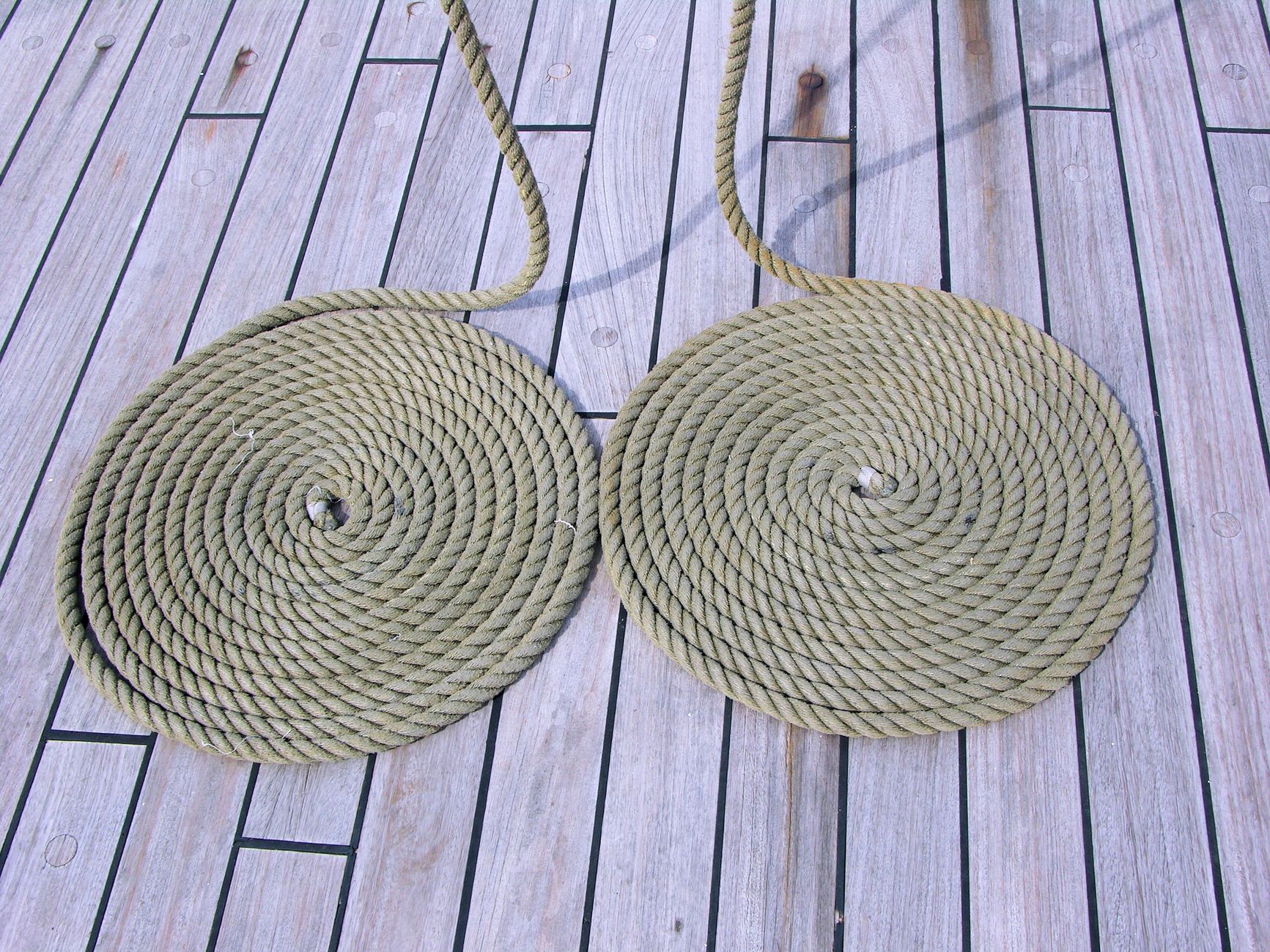 Coiled ropes on a wooden boat deck