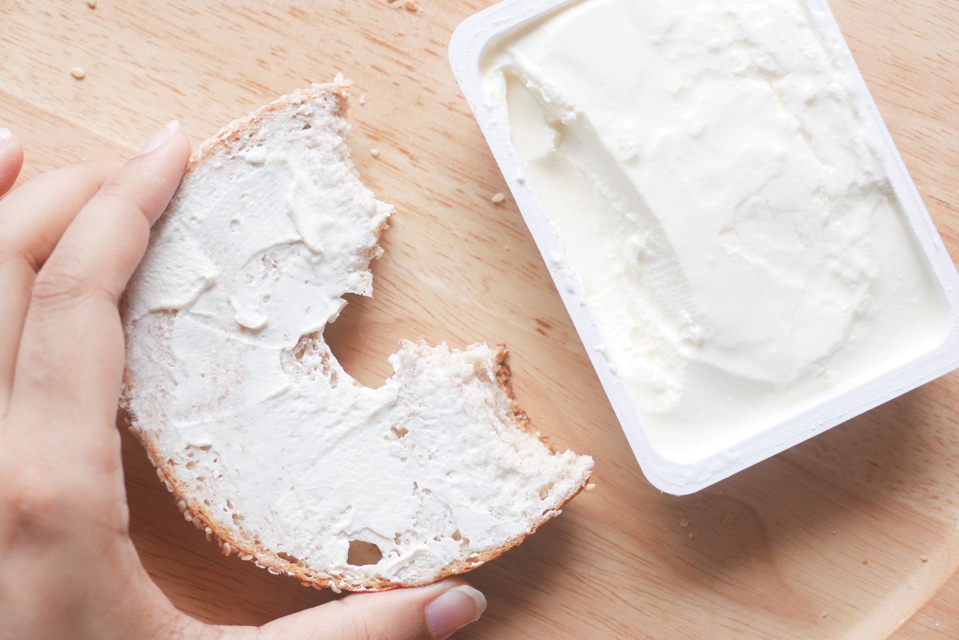A slice of bread spread with cream cheese