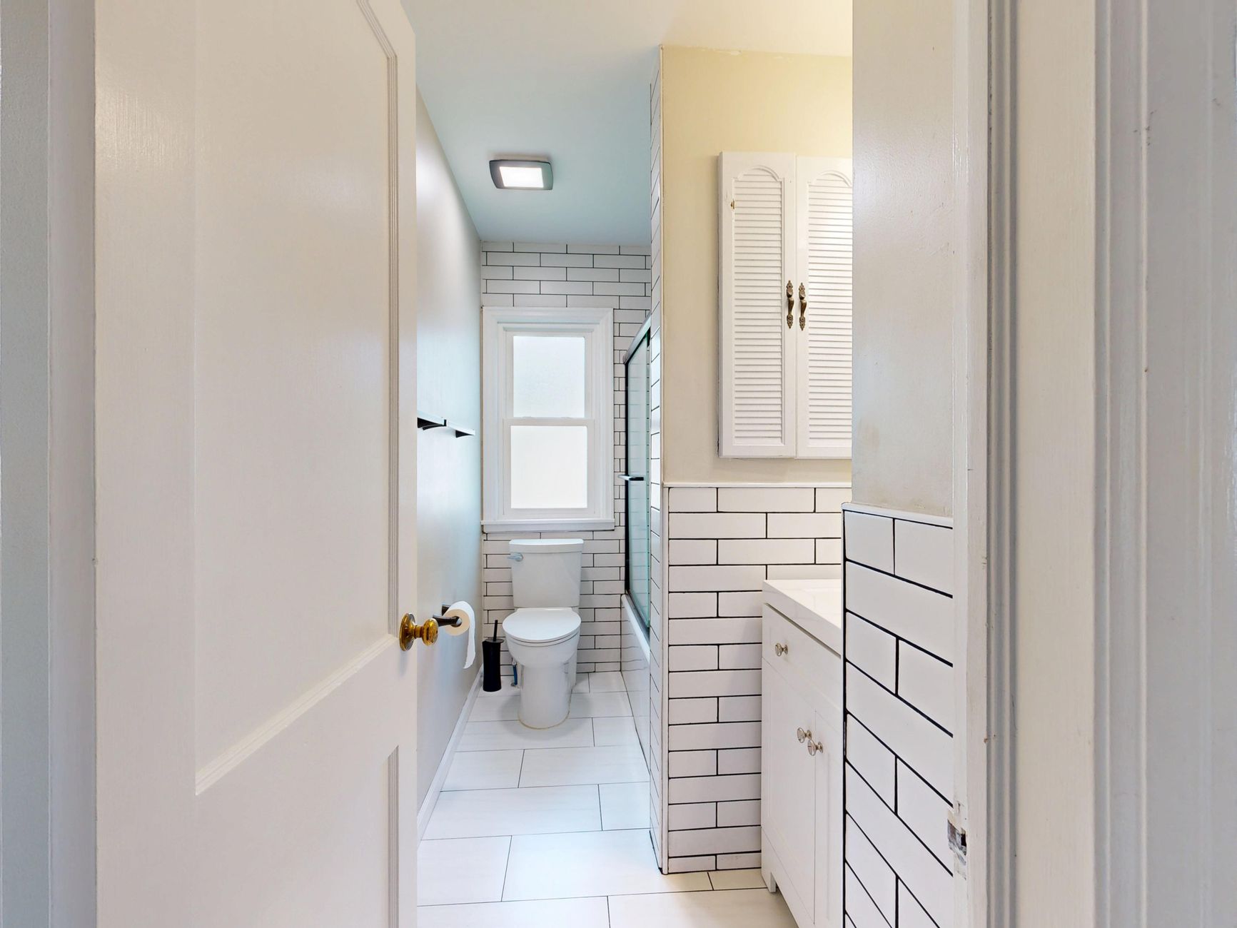 A small bathroom with a compact layout