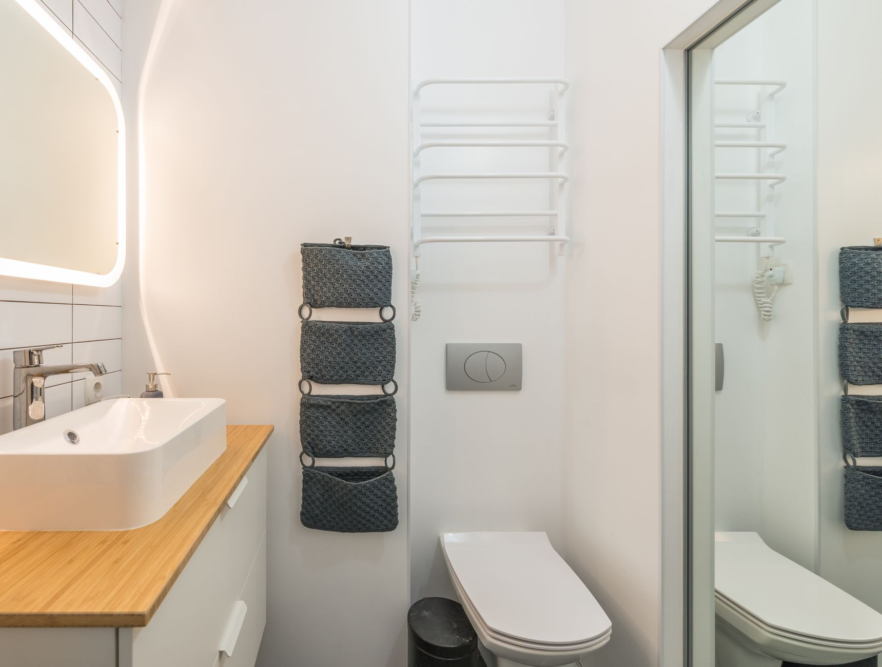 A modern bathroom with a wall-hung toilet