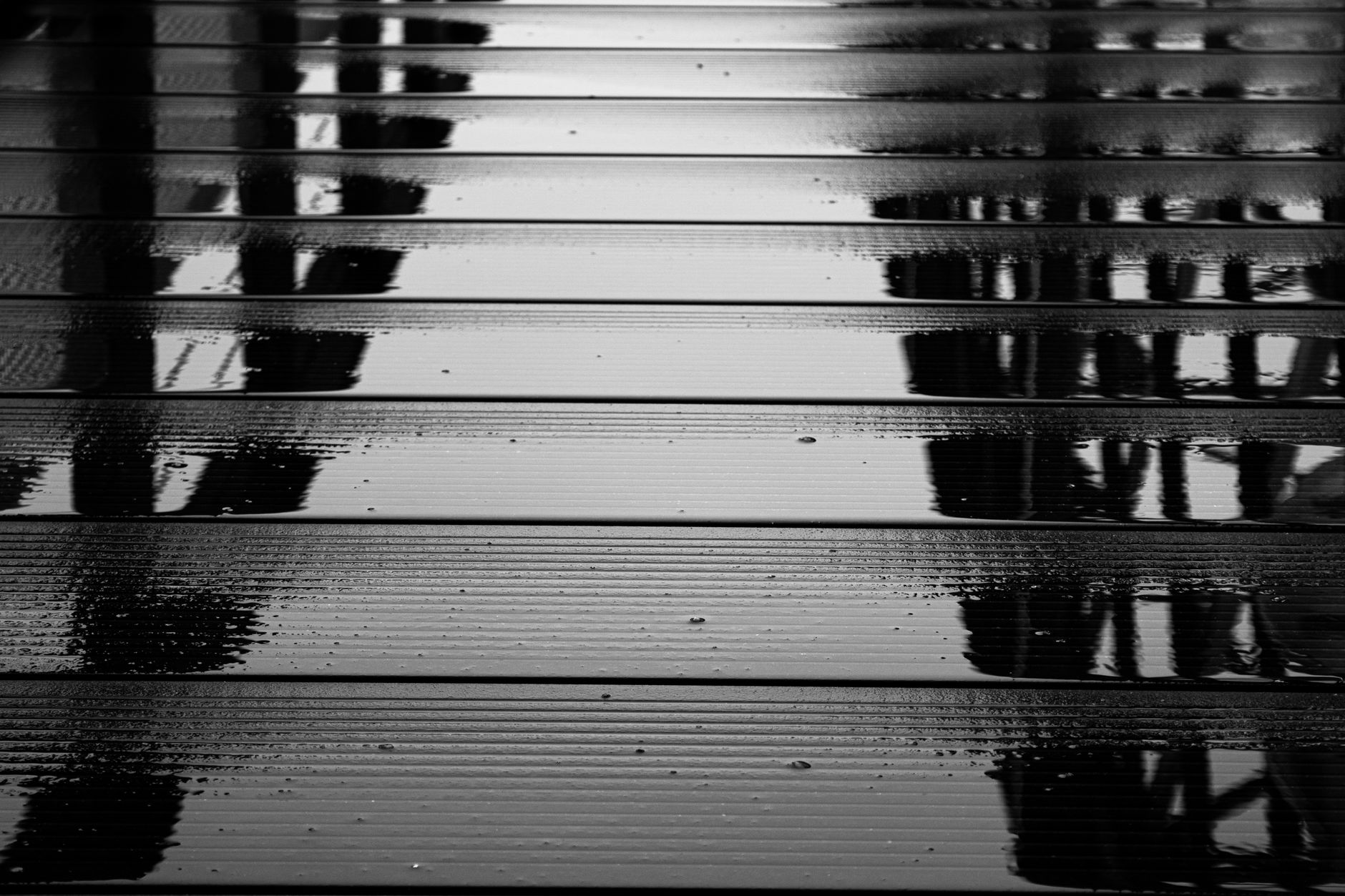 Water beading on a dark floor