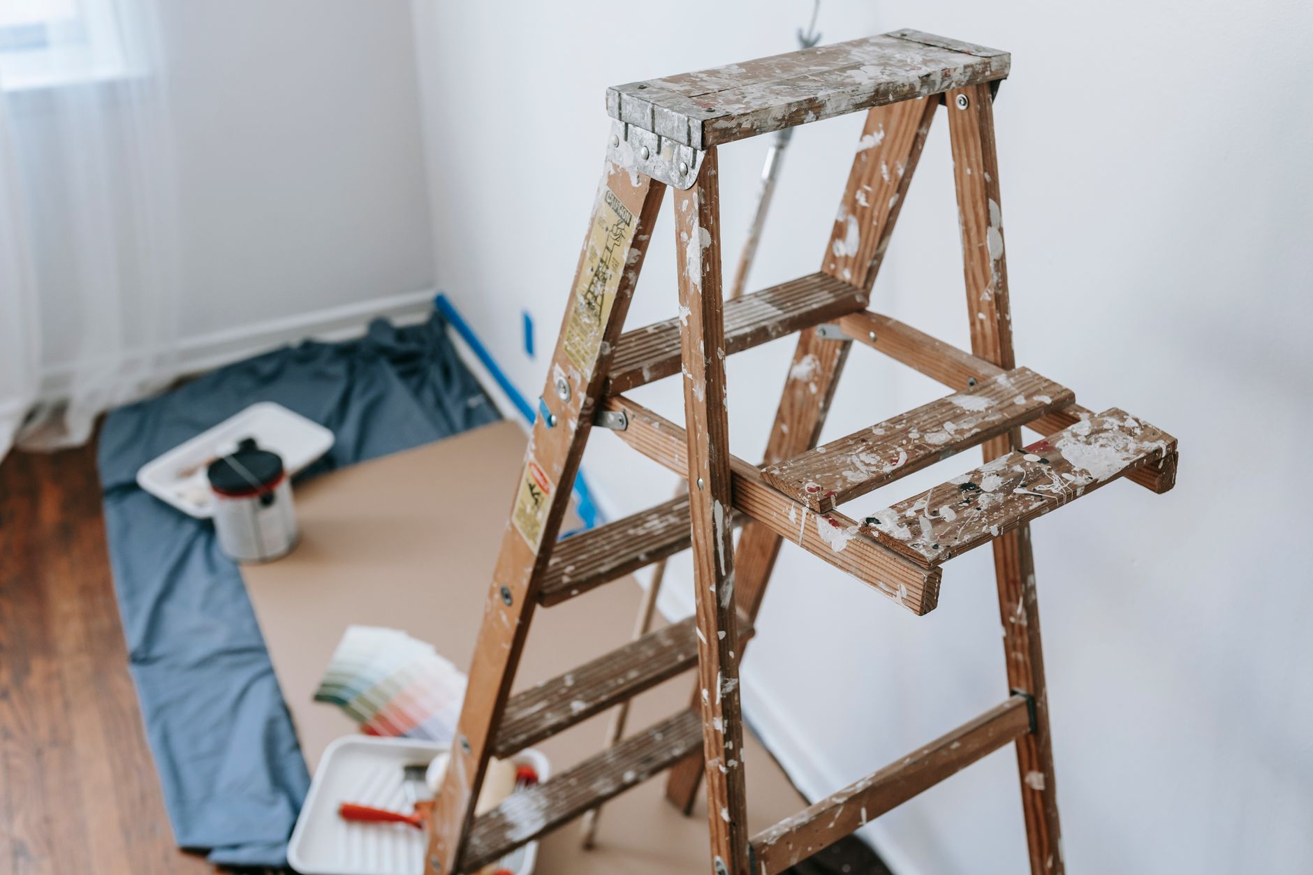 A ladder leaning against the side of a house