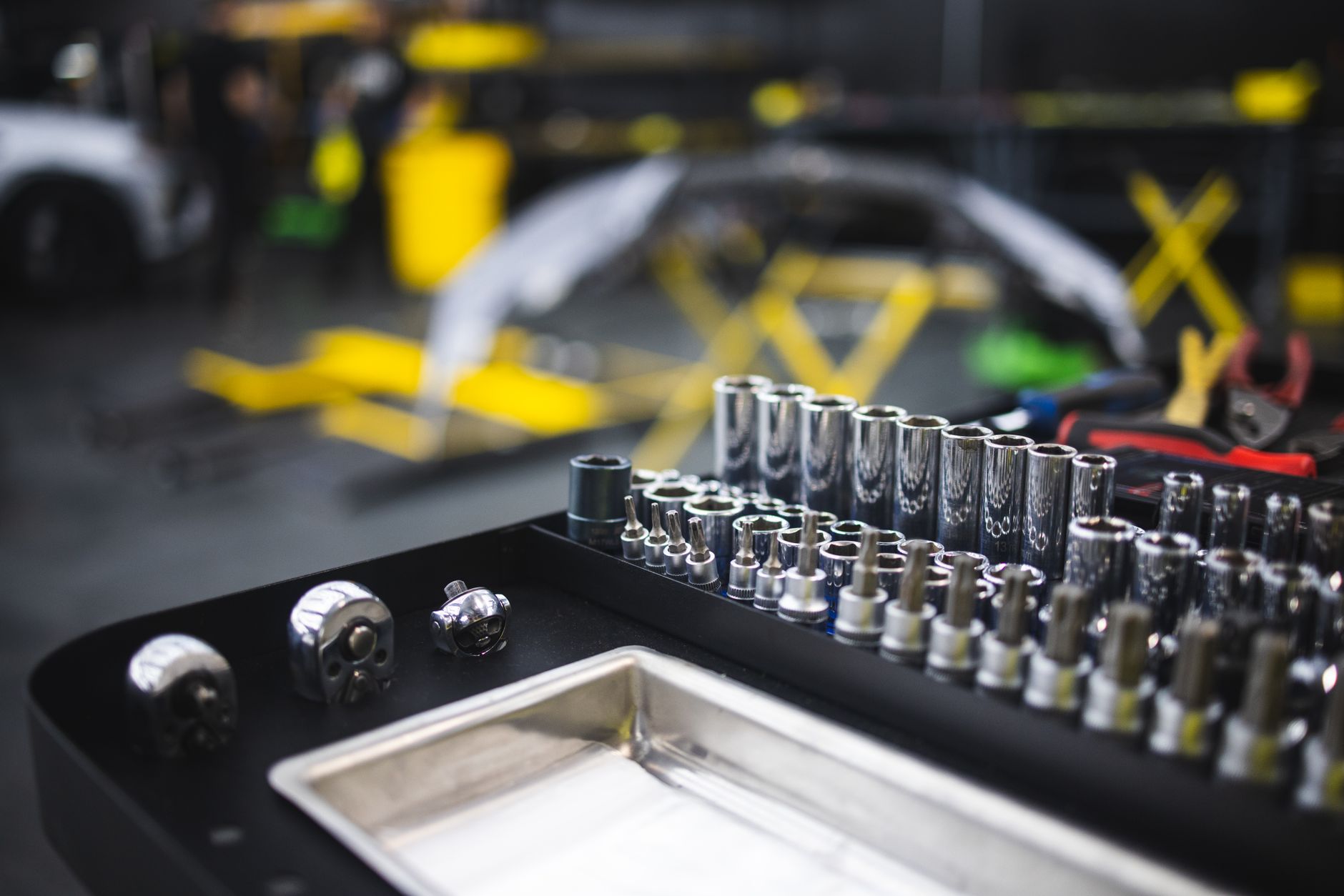 A tray of sockets on a tool cart