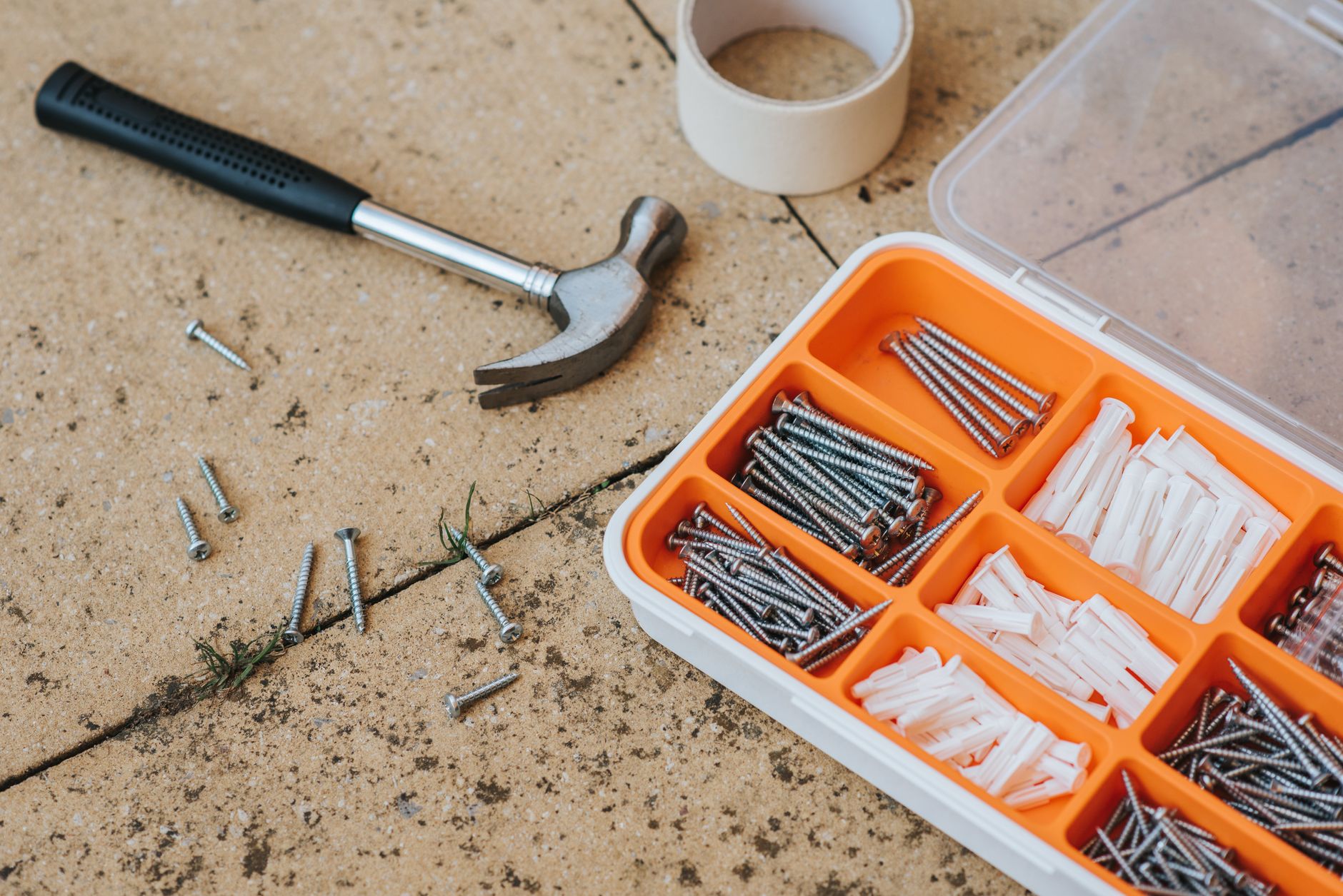 A hammer, nails and an organizer box