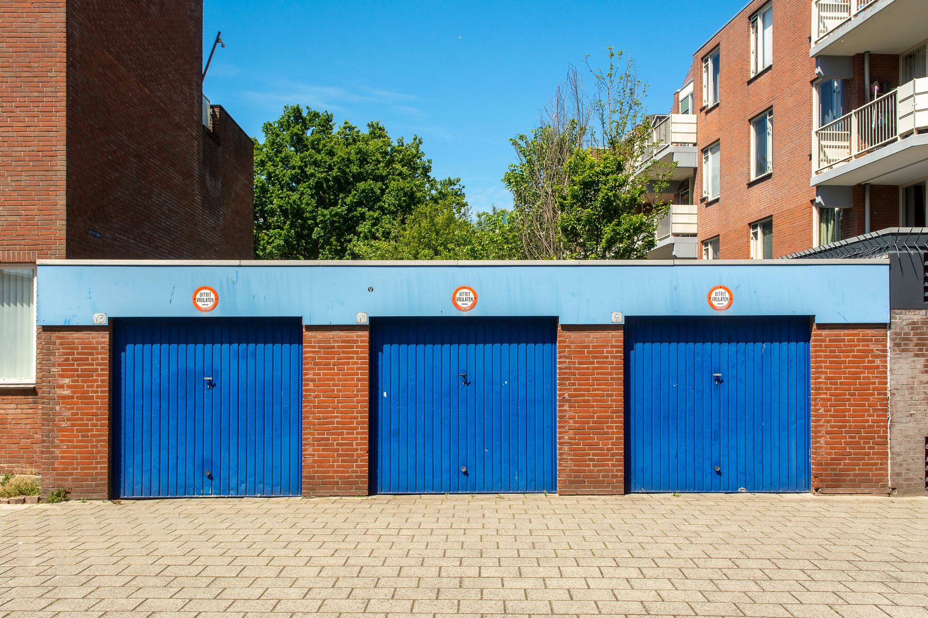A row of blue garage doors