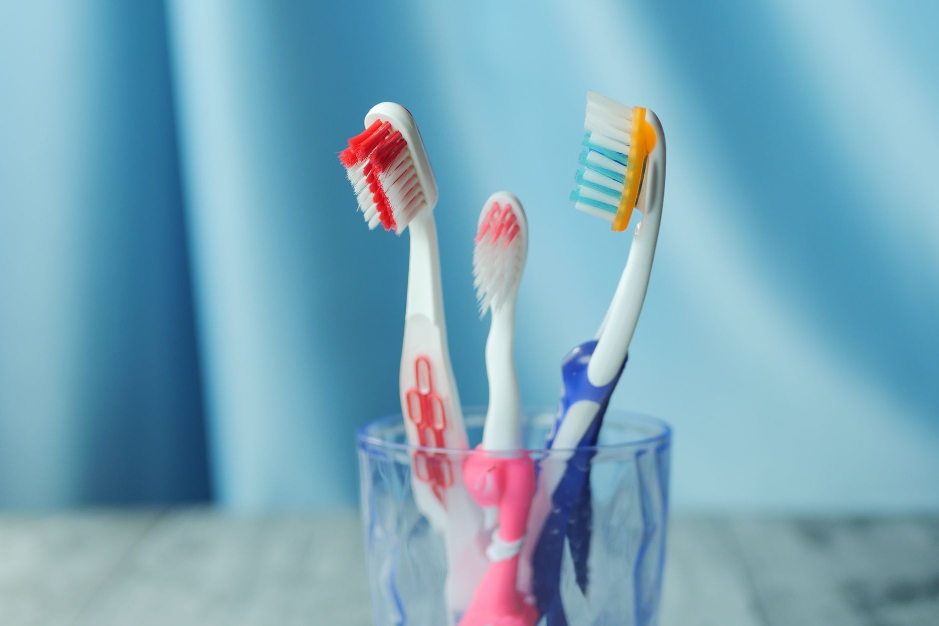 Toothbrushes in a glass cup