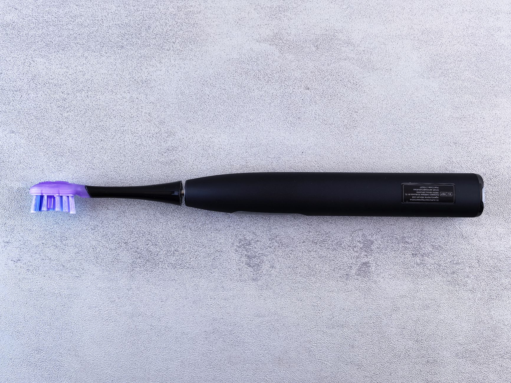 An electric toothbrush on a counter