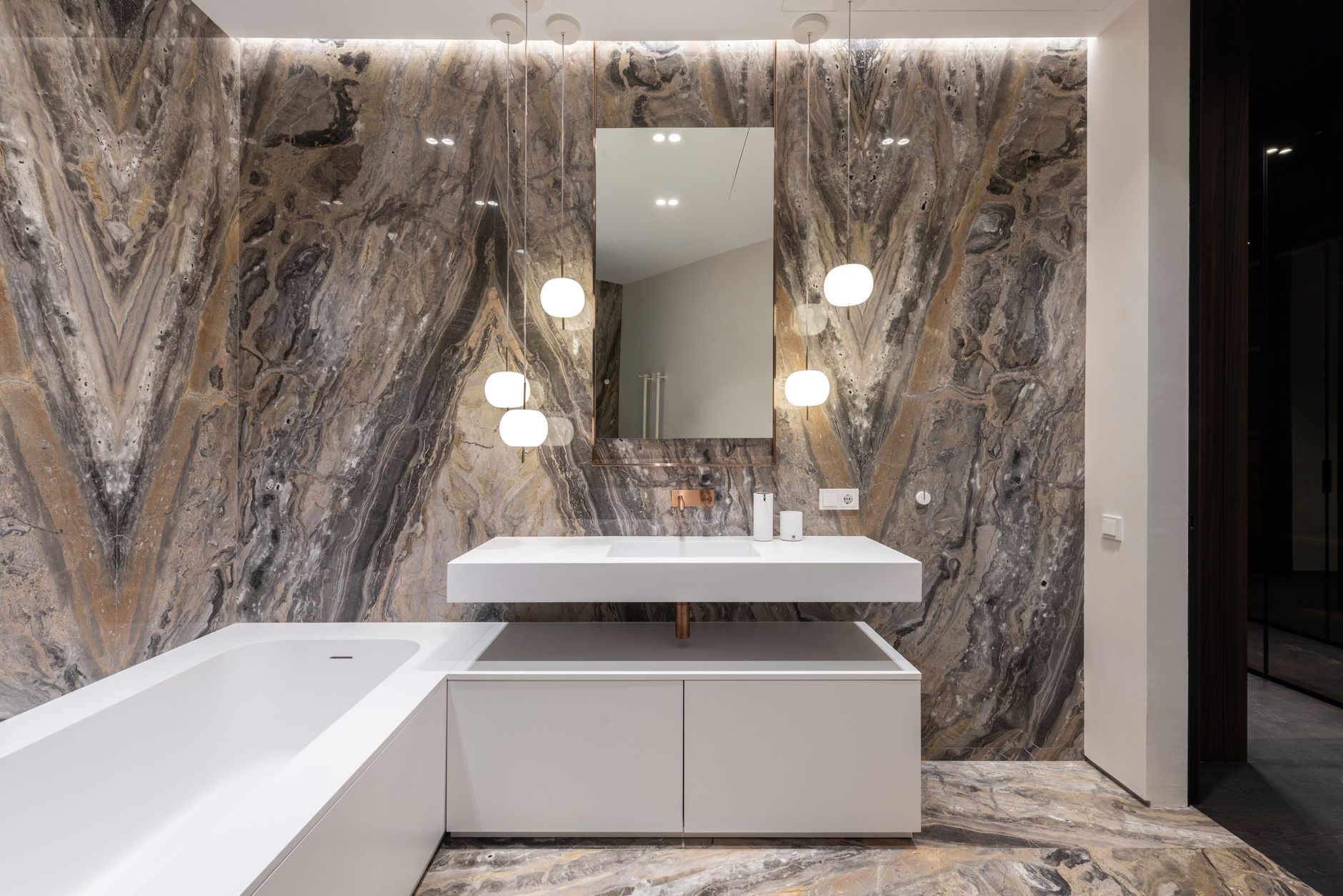 A modern bathroom wall with fixtures