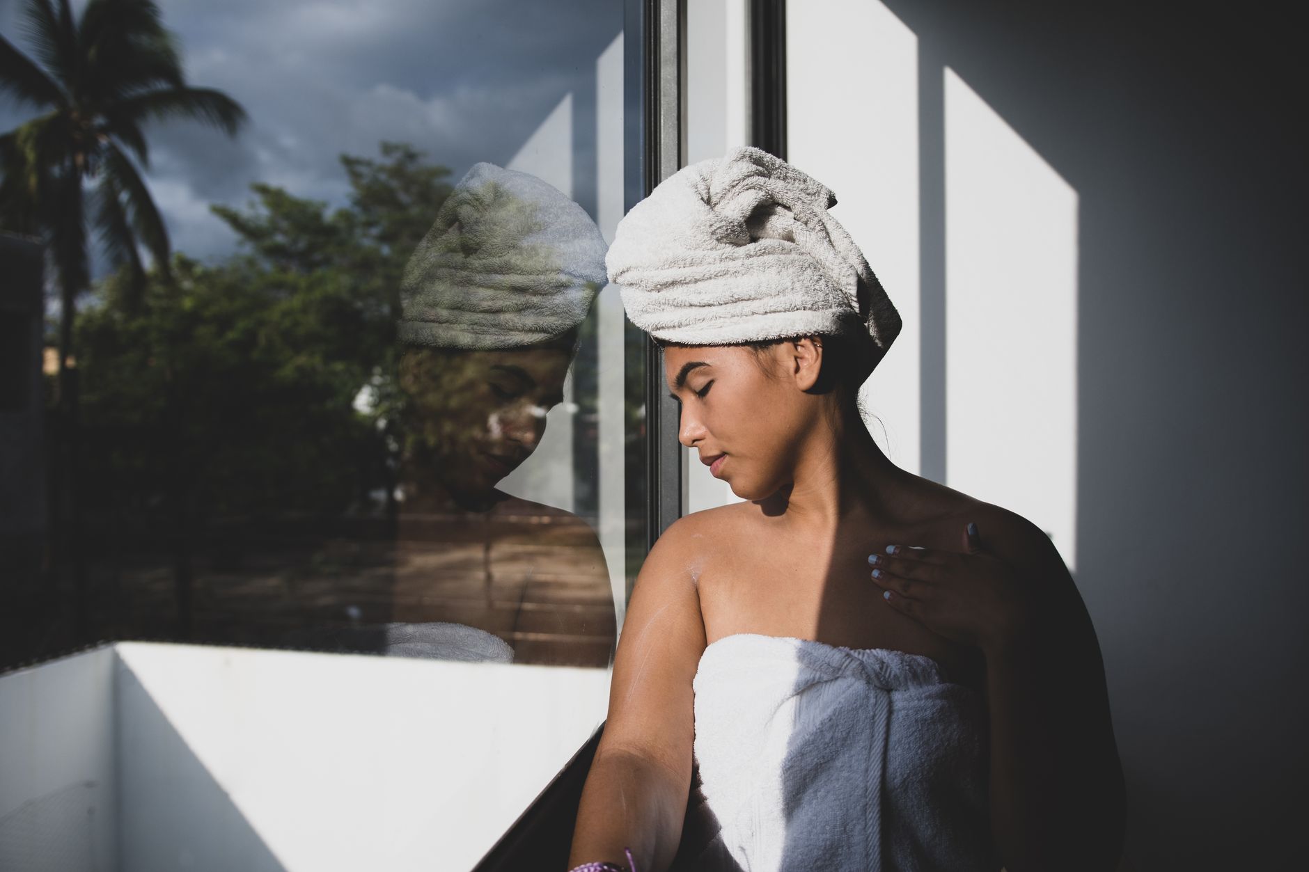 A woman wrapped in a towel after bathing