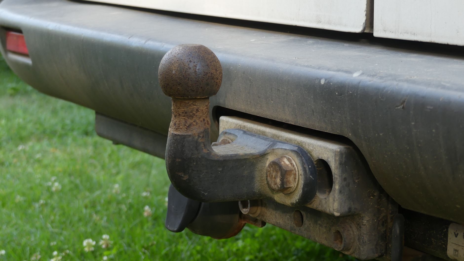 A tow ball hitch on the back of a vehicle