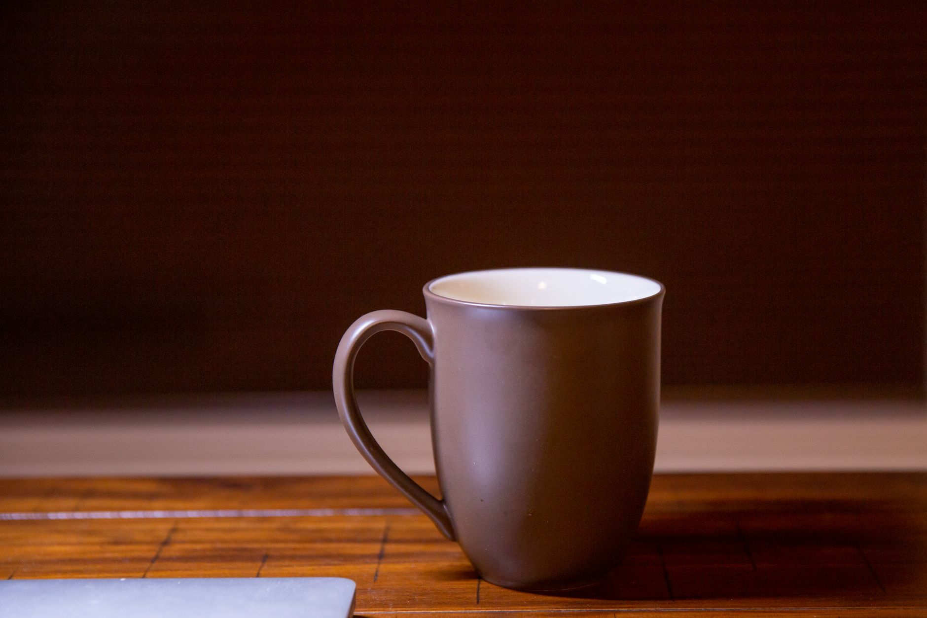 A mug of coffee on a table in the morning