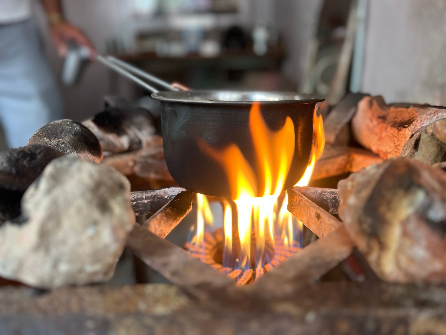 A pot cooking on a kitchen stove