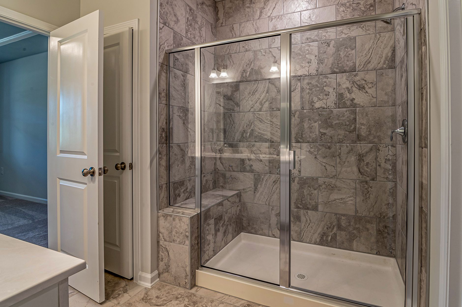 A walk-in glass shower