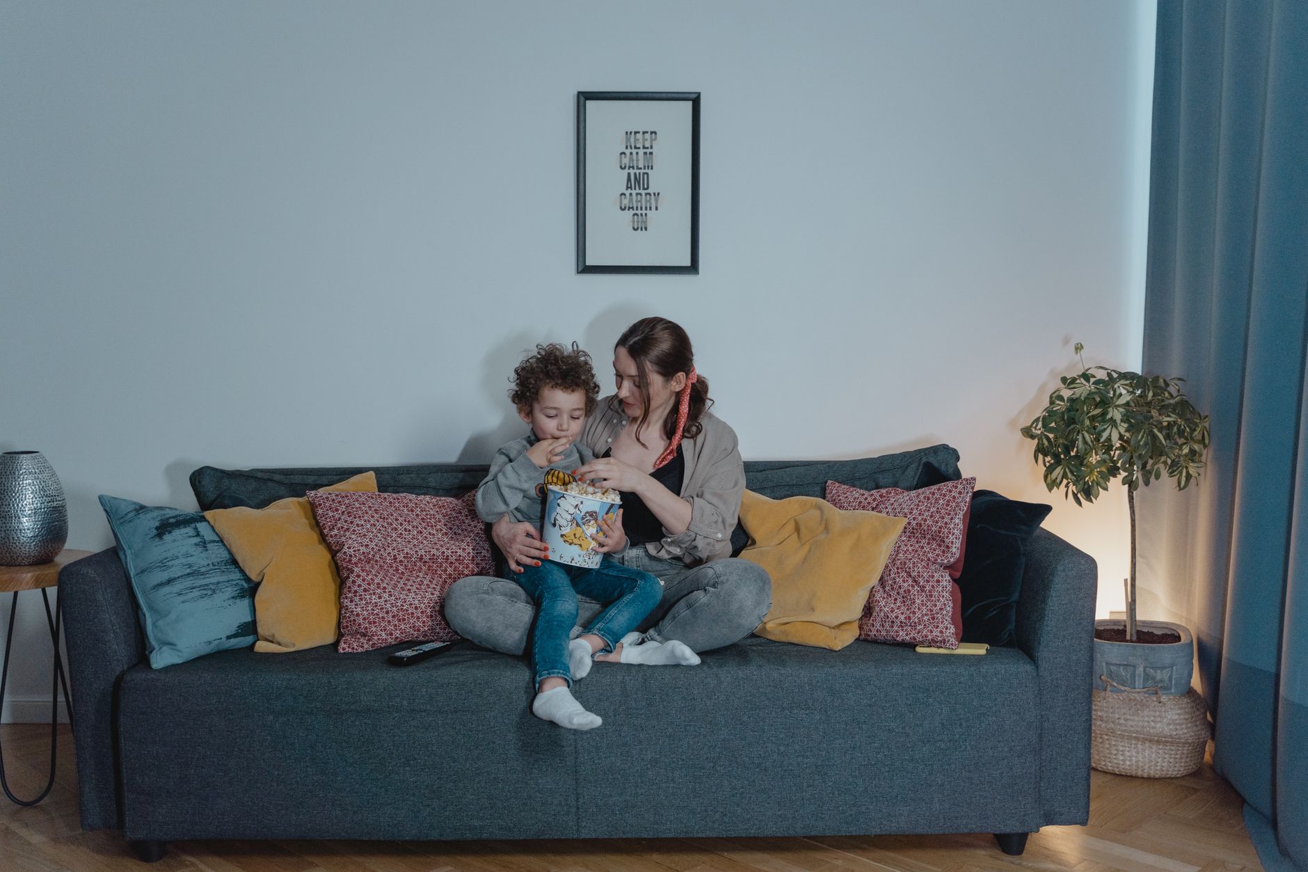 A family relaxing on a living room couch
