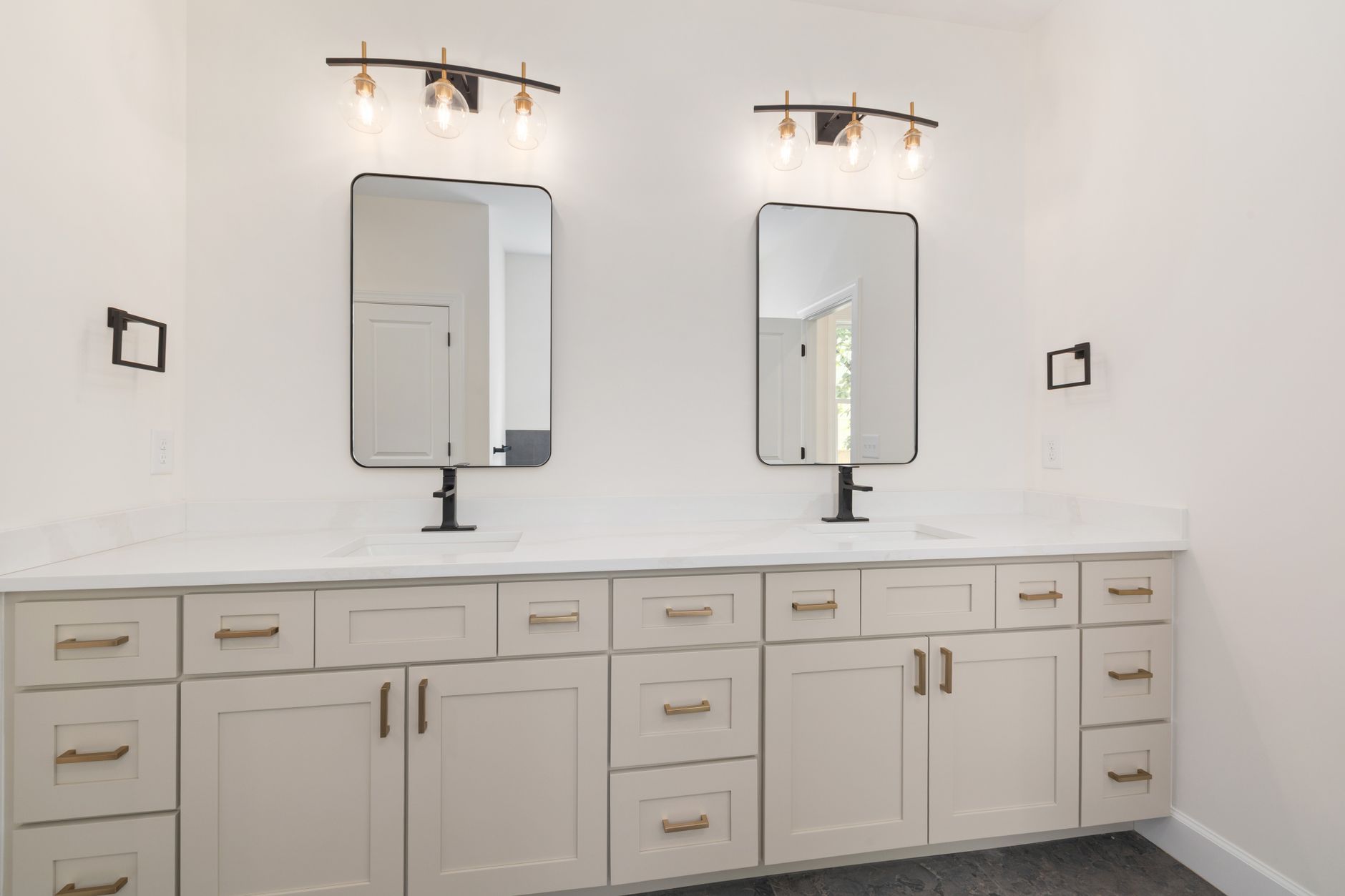 A double vanity with drawers and cabinets