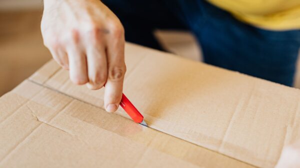 Best utility knife: cutting a cardboard box with a box cutter