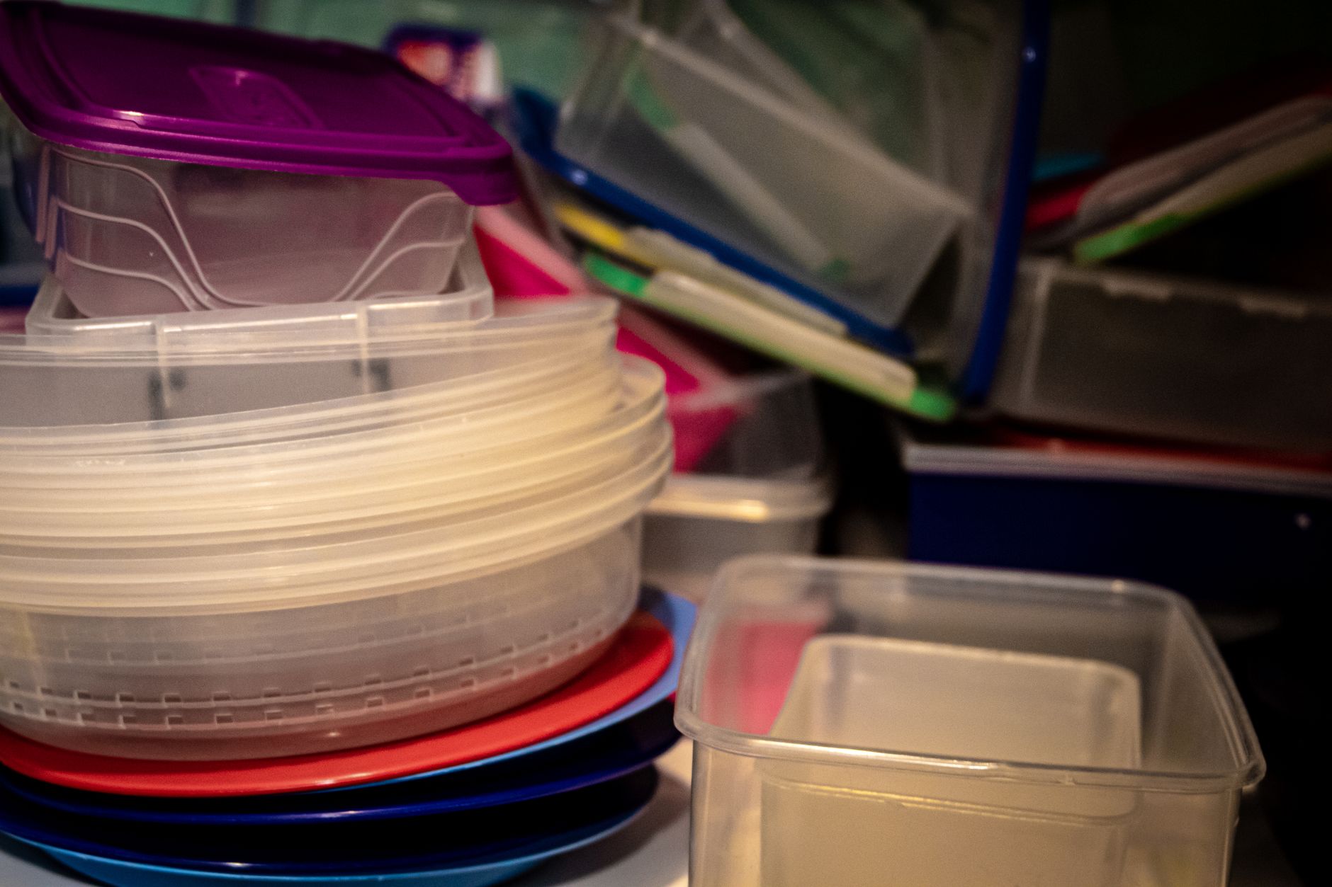 A pile of plastic food containers
