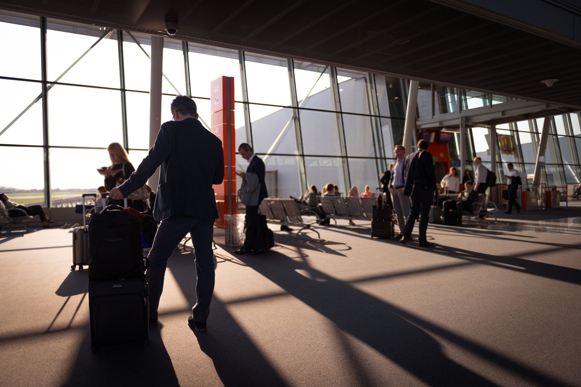 Travelers with luggage in an airport