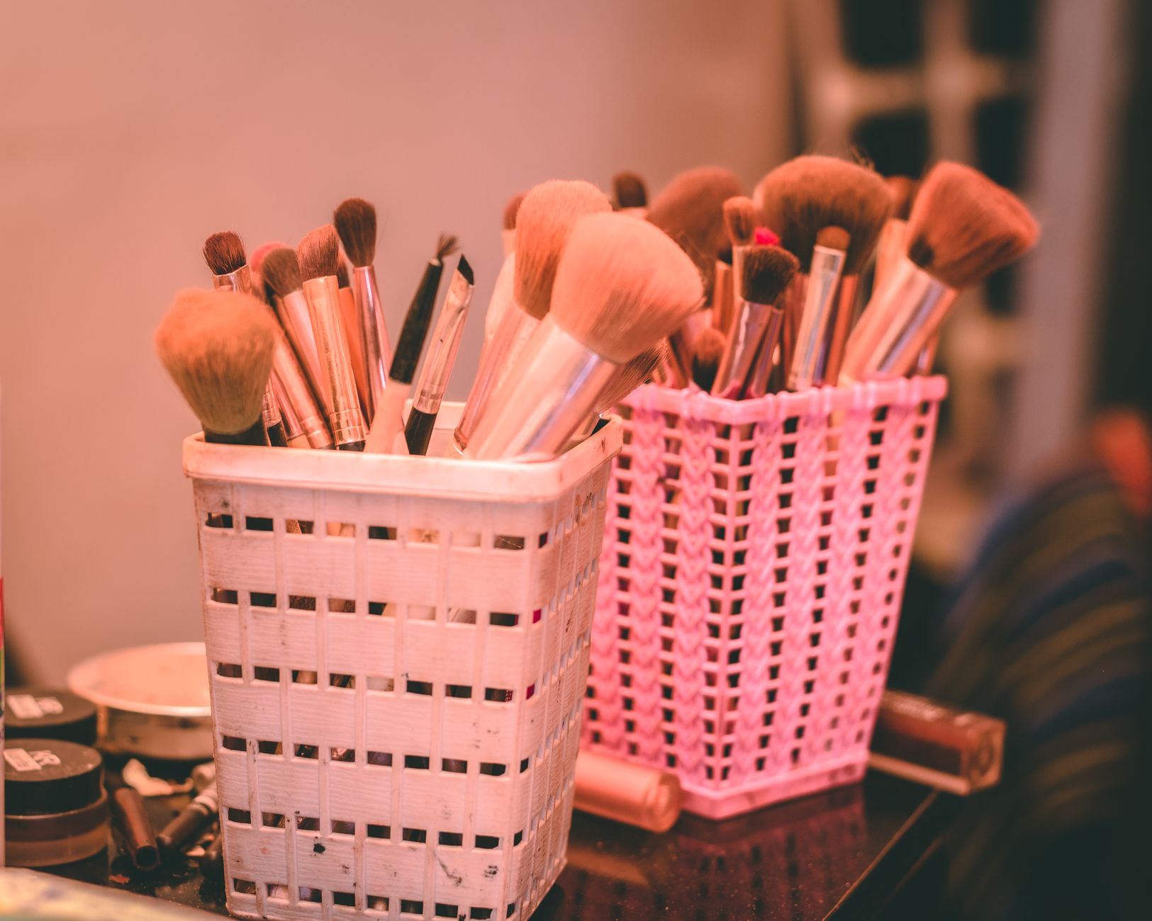 Makeup brushes on a vanity table