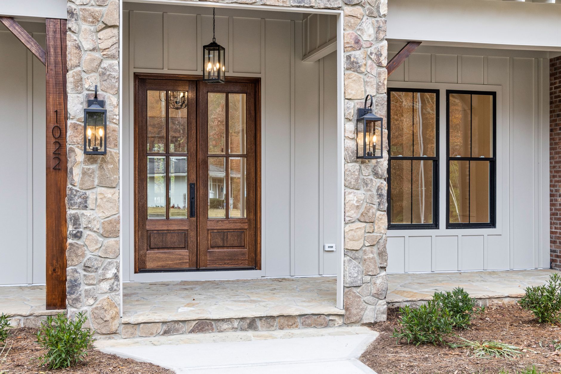 A front entry with double wood doors