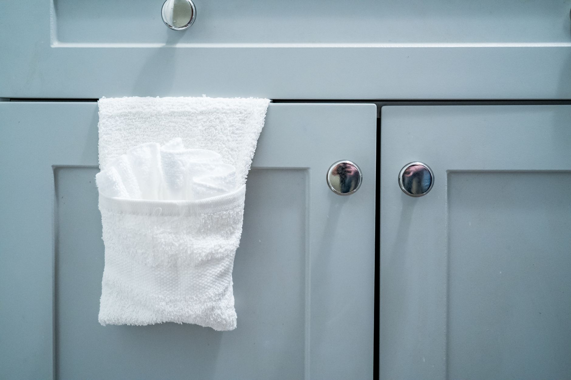 A towel hanging on a hook in a bathroom