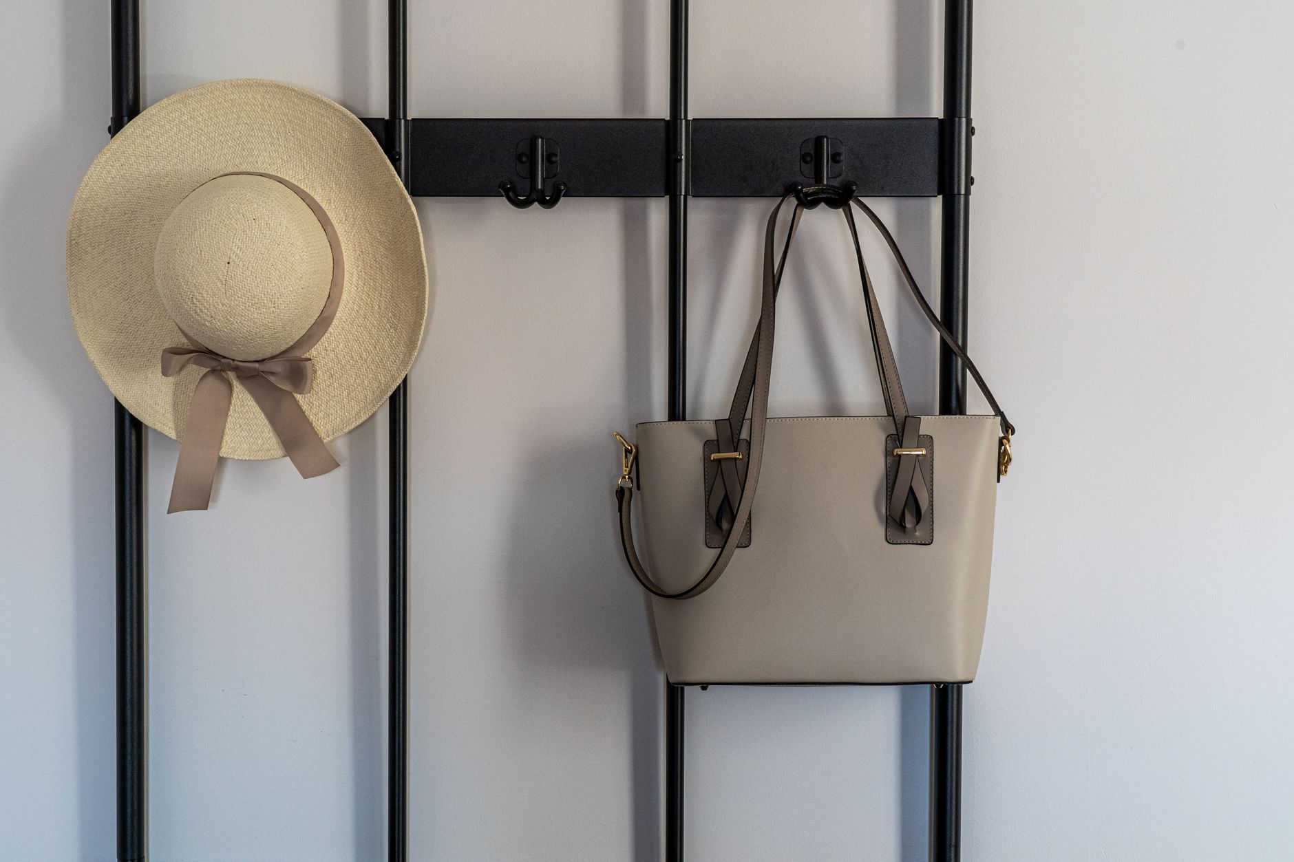 Hats and bags hanging on a wall